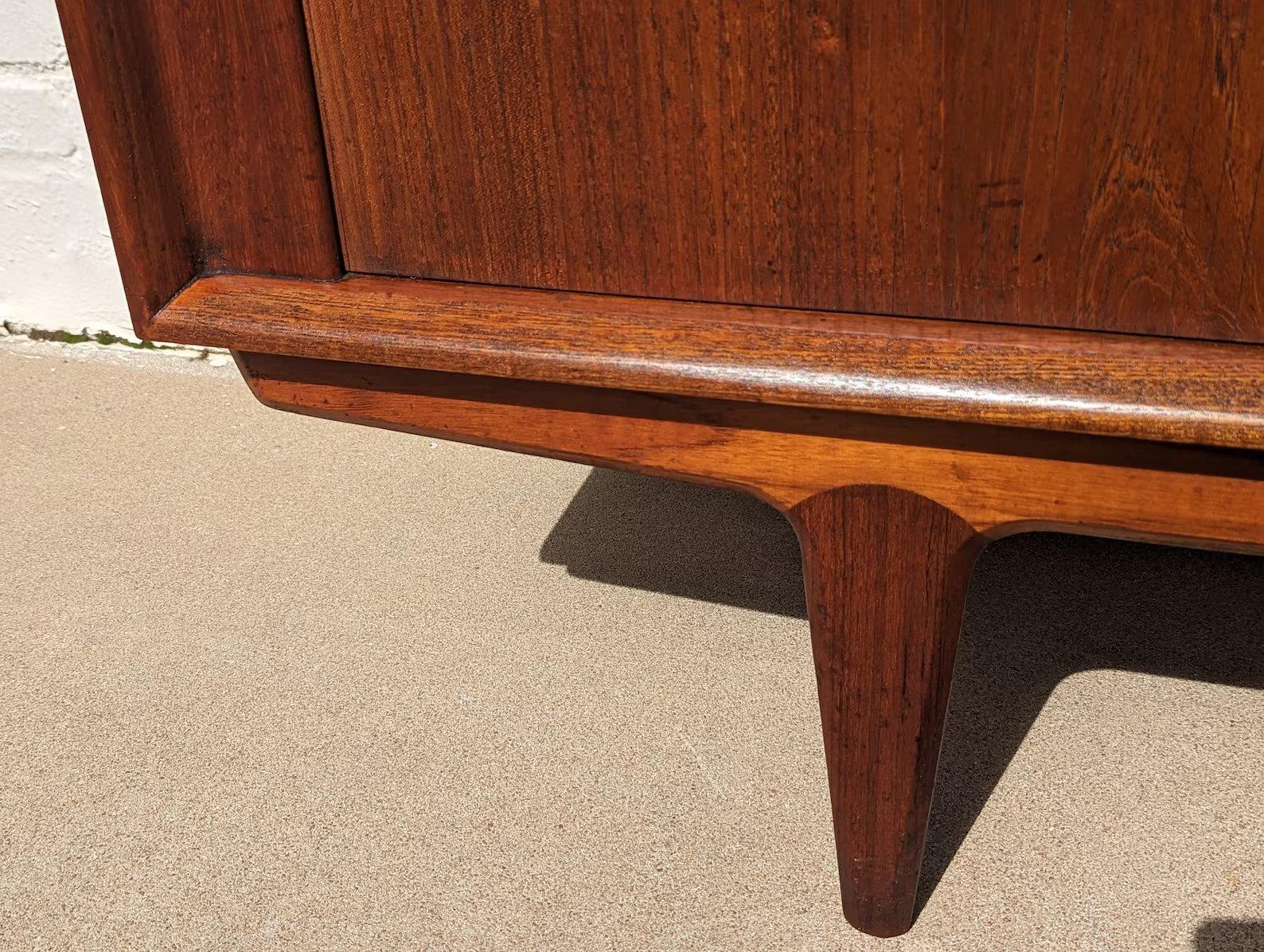Mid Century Danish Modern Teak Credenza by Bernhard Pedersen and Sons
 
Above average vintage condition and structurally sound. Has some expected slight finish wear and scratching. Top and front trim have been refinished. Both vertical sides of