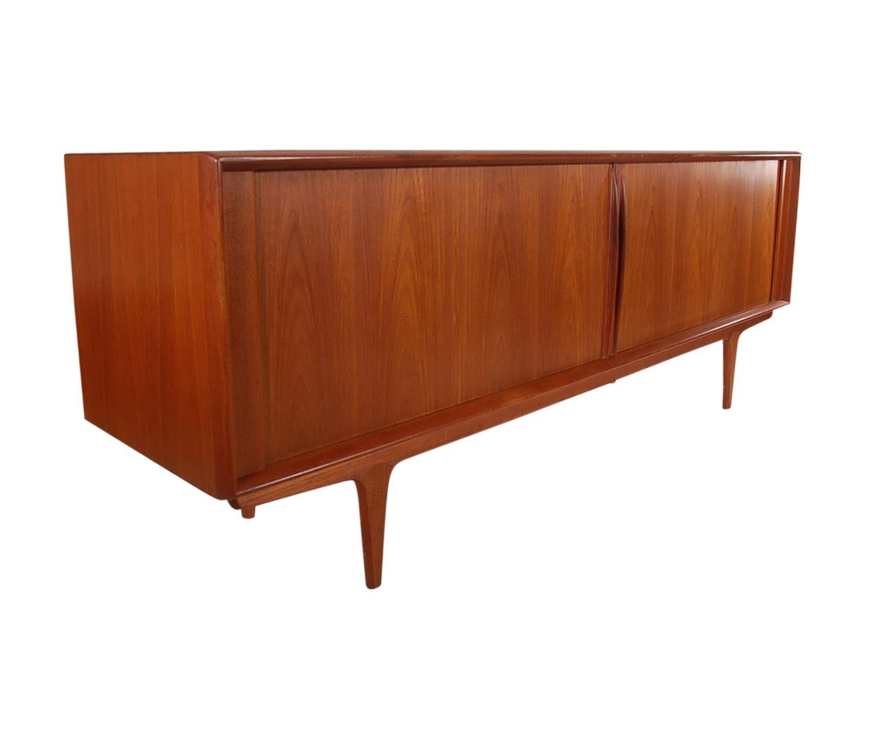 A lovely and long teak credenza produced by Bernhard Pedersen & Son in the 1960s. This cabinet is very clean and has ample storage. Manufactures label. Doors and drawers work as they should. Ready for immediate use.