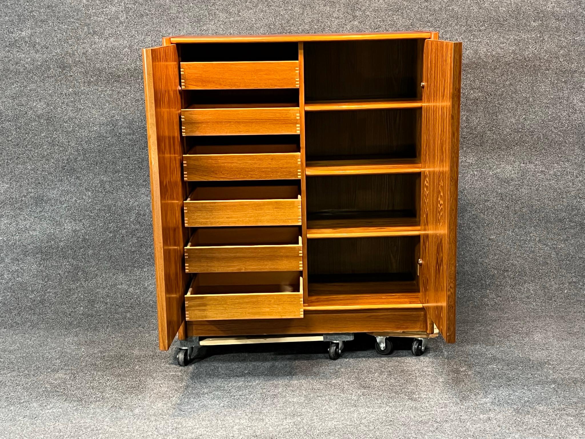Mid-Century Danish Modern Teak Cupboard Armoire Gentleman's Chest by Jesper.  Ample, functional storage for any room in the house with 6 drawers and three shelves.  Finely crafted finger joints on the drawers exemplify quality of construction and