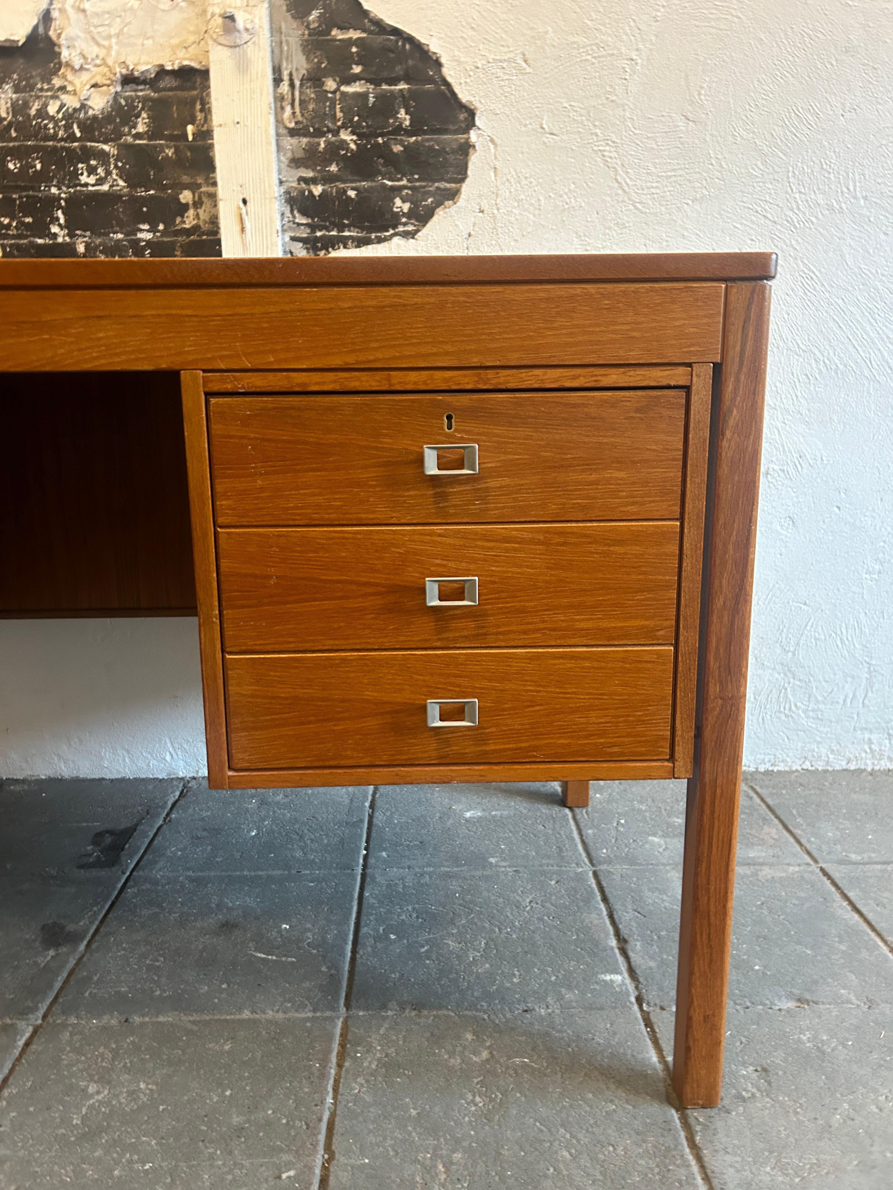 Scandinavian Modern Mid century Danish modern teak desk with nickel handles with key For Sale