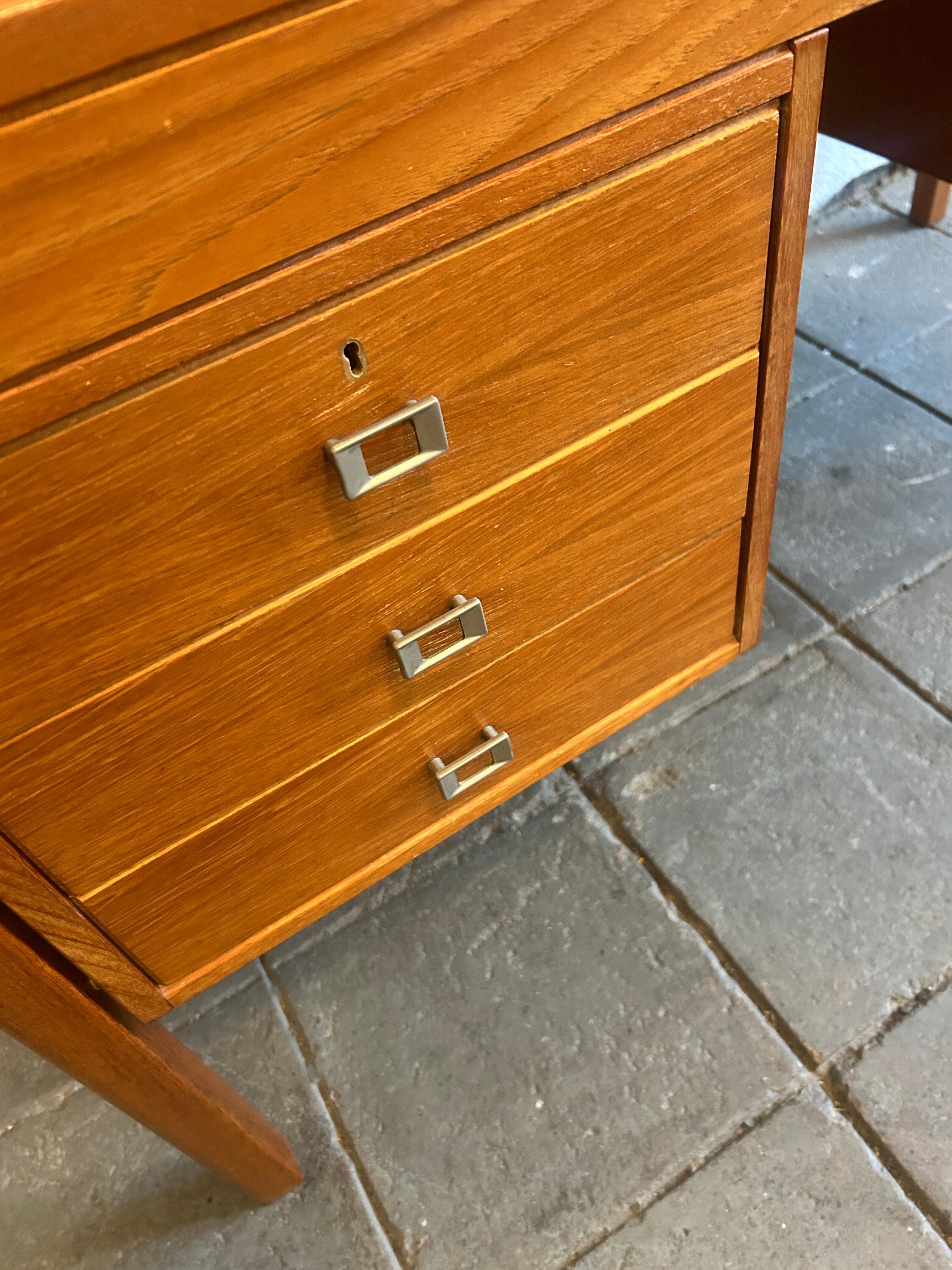Mid century Danish modern teak desk with nickel handles with key In Good Condition For Sale In BROOKLYN, NY