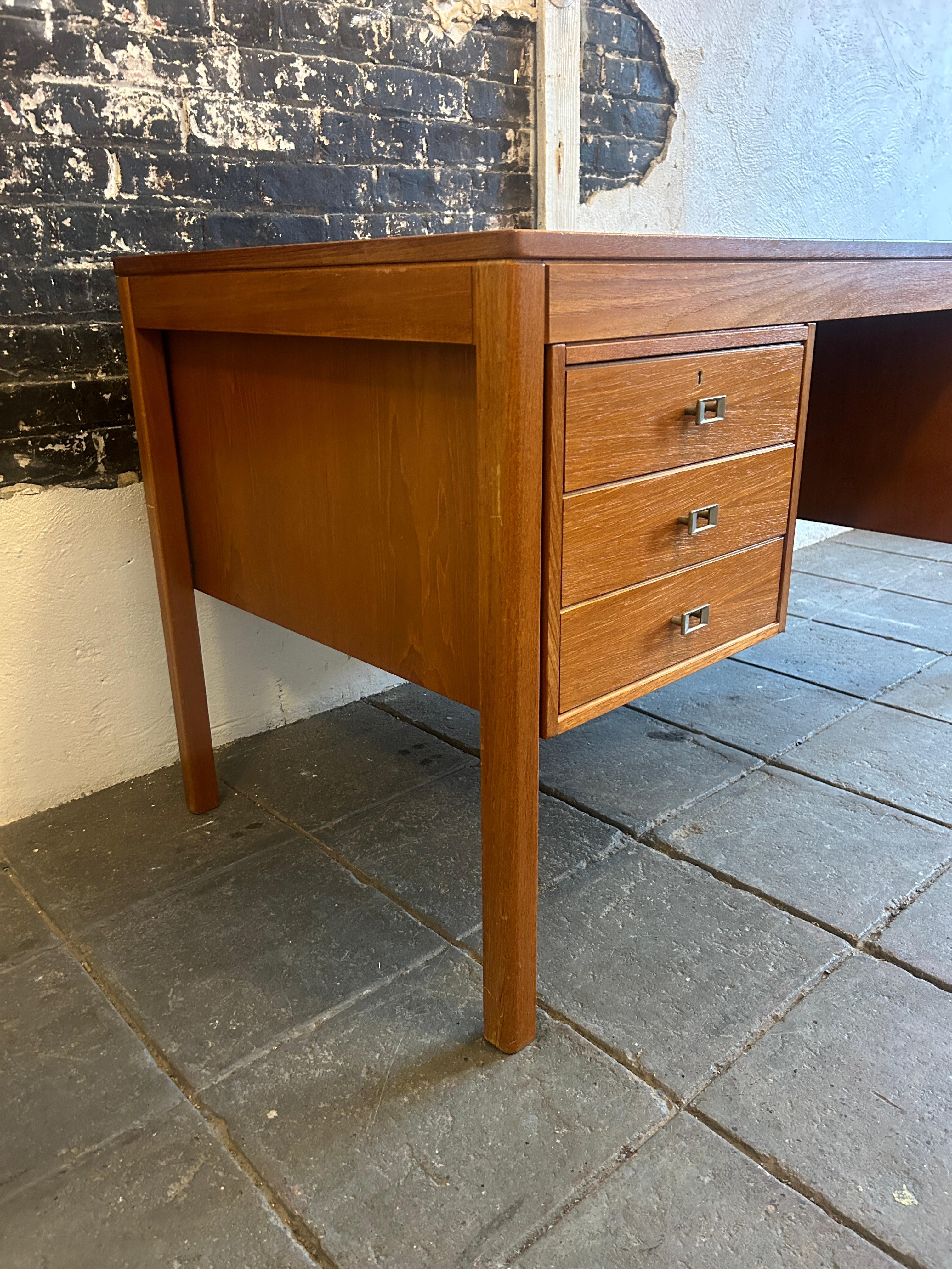 Late 20th Century Mid century Danish modern teak desk with nickel handles with key For Sale