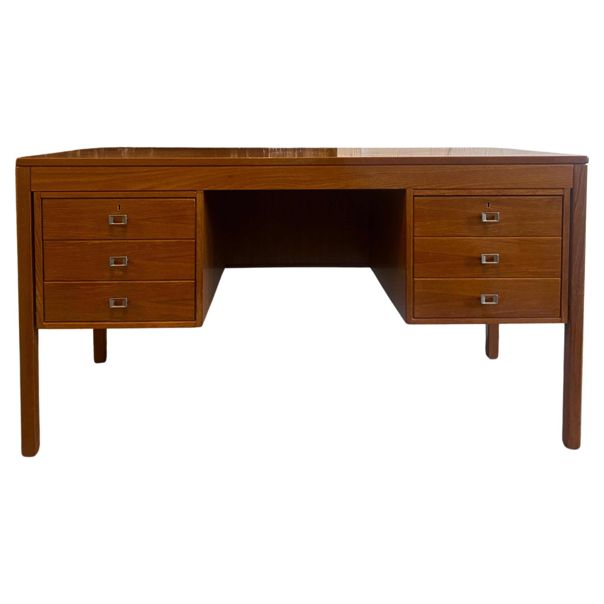 Mid century Danish modern teak desk with nickel handles with key