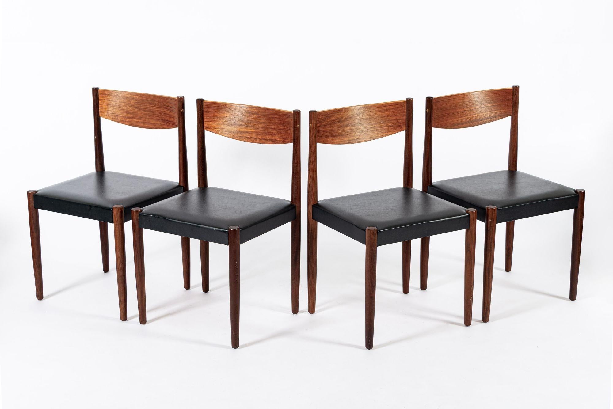 This lovely vintage mid century Danish modern set of four dining chairs was designed by Poul Volther for Frem Rojle and made in Denmark circa 1960. The dining chairs are well-constructed and have a classic Scandinavian modern design with clean,