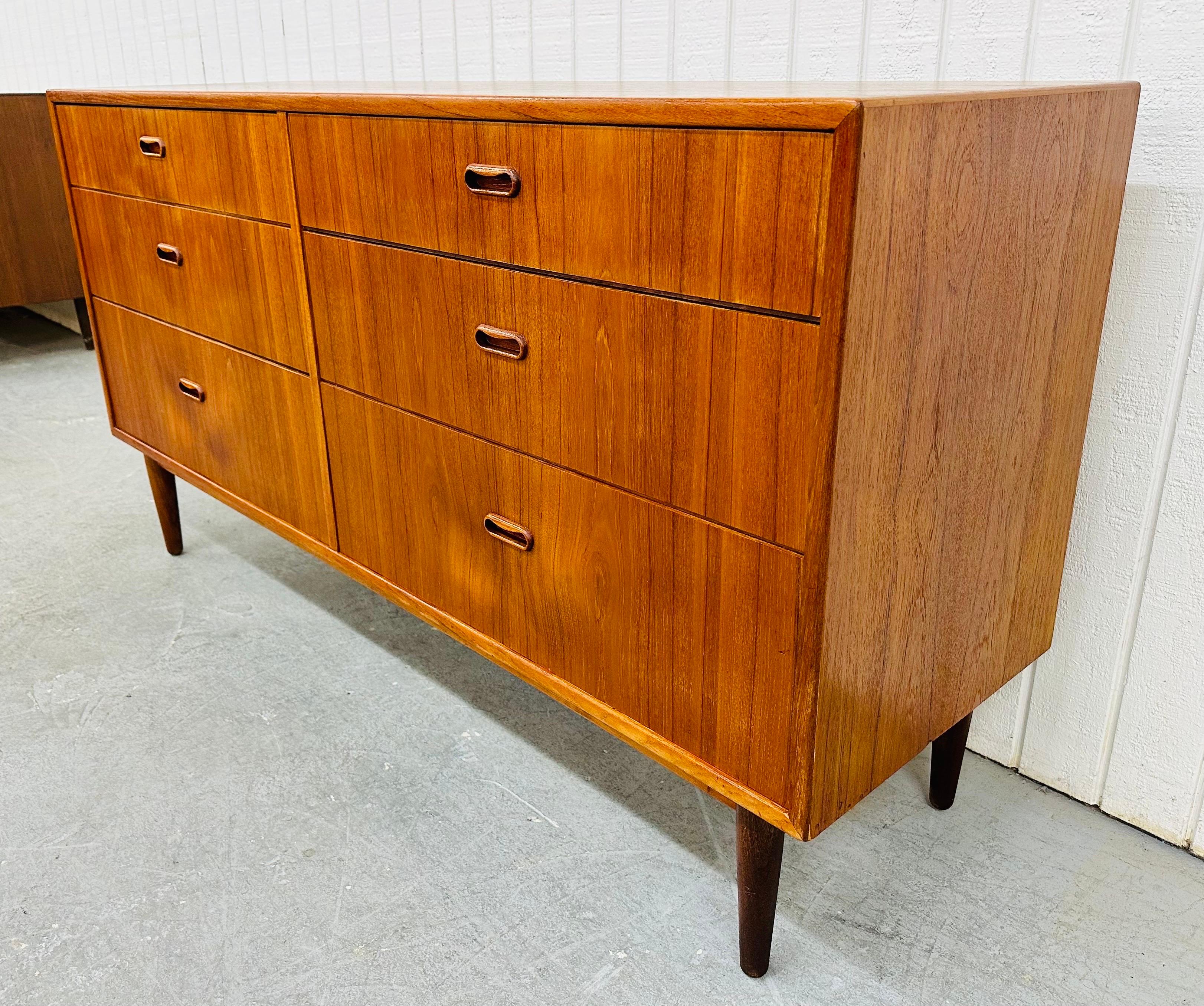 This listing is for a Mid-Century Danish Modern Teak Double Dresser. Featuring a straight line design, six large drawers for storage, recessed wooden pulls, modern legs, and a beautiful teak finish! This is an exceptional combination of quality and