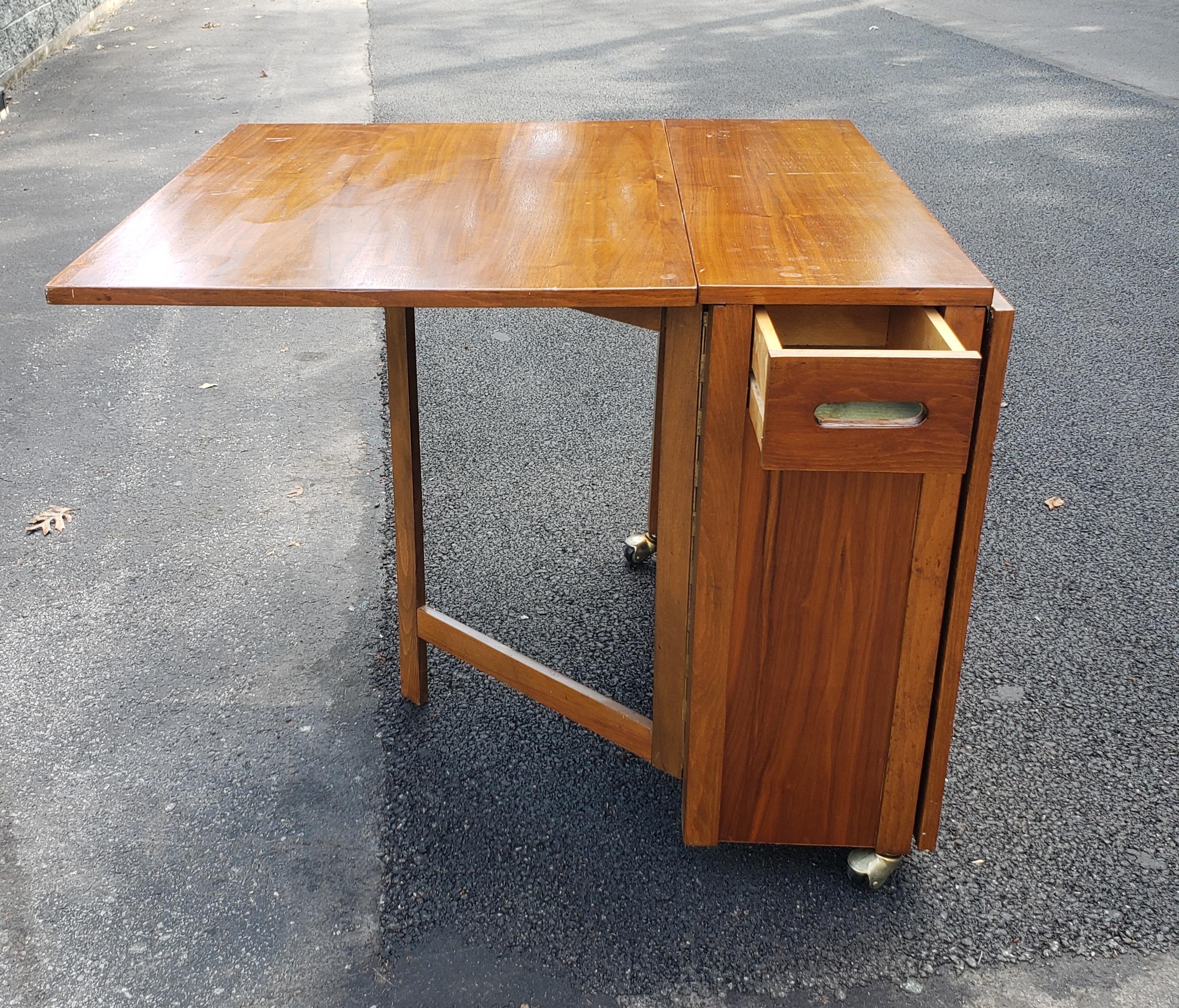Mid-Century Danish Modern Teak Drop-Leaf Dining Table with Storage on Rollers For Sale 5