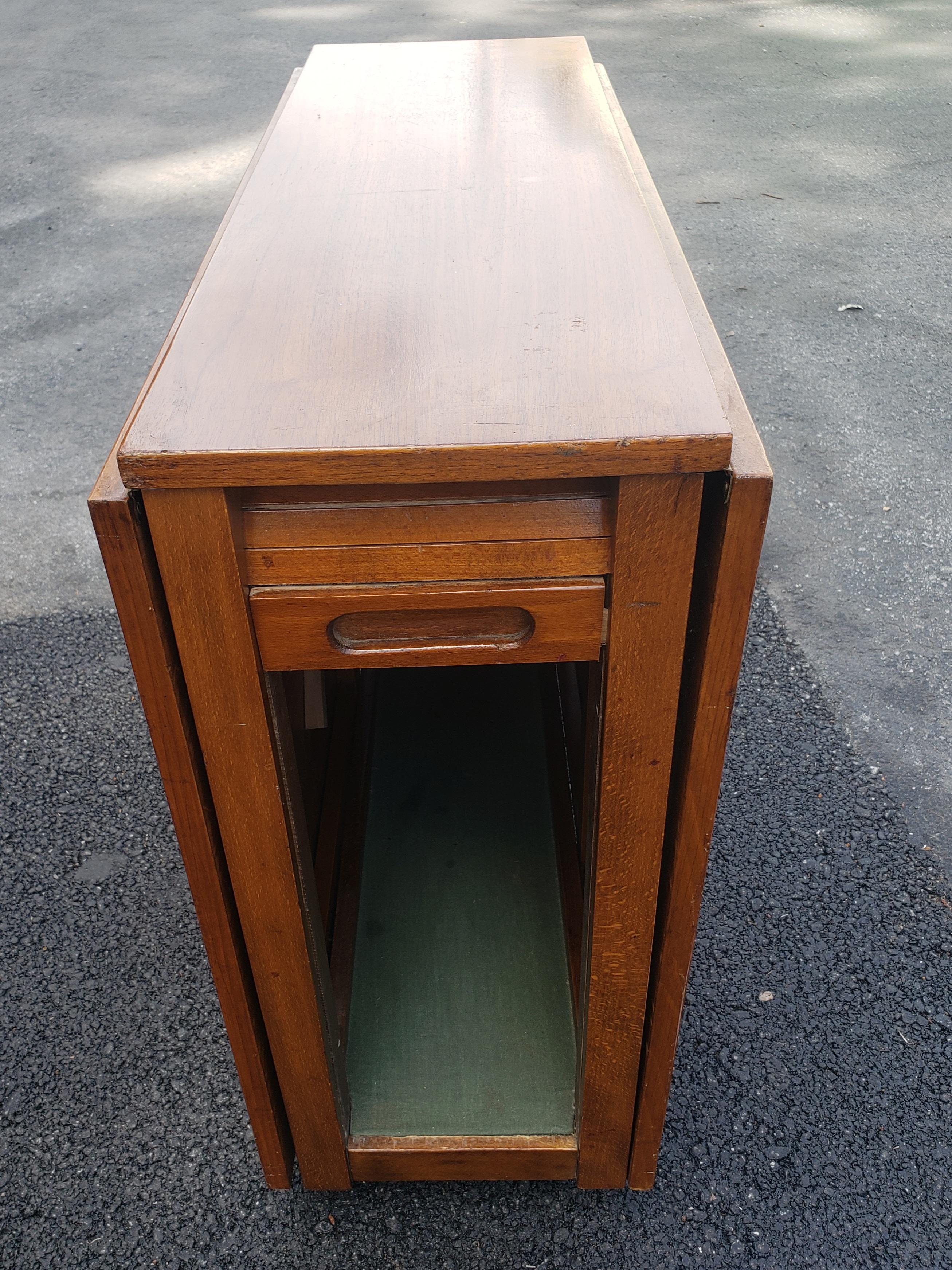 Mid-Century Danish Modern Teak Drop-Leaf Dining Table with Storage on Rollers For Sale 7