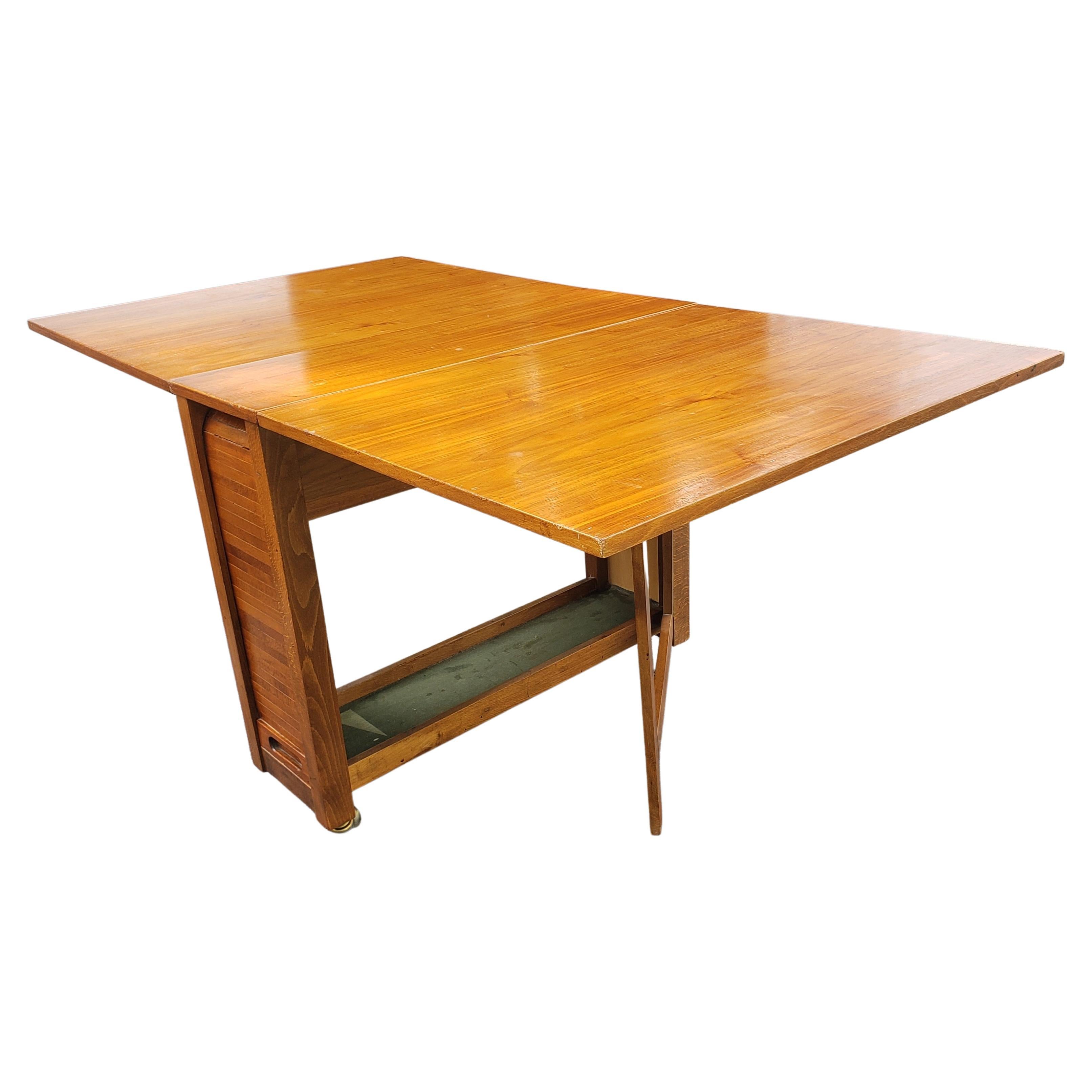 drop leaf table with storage for chairs