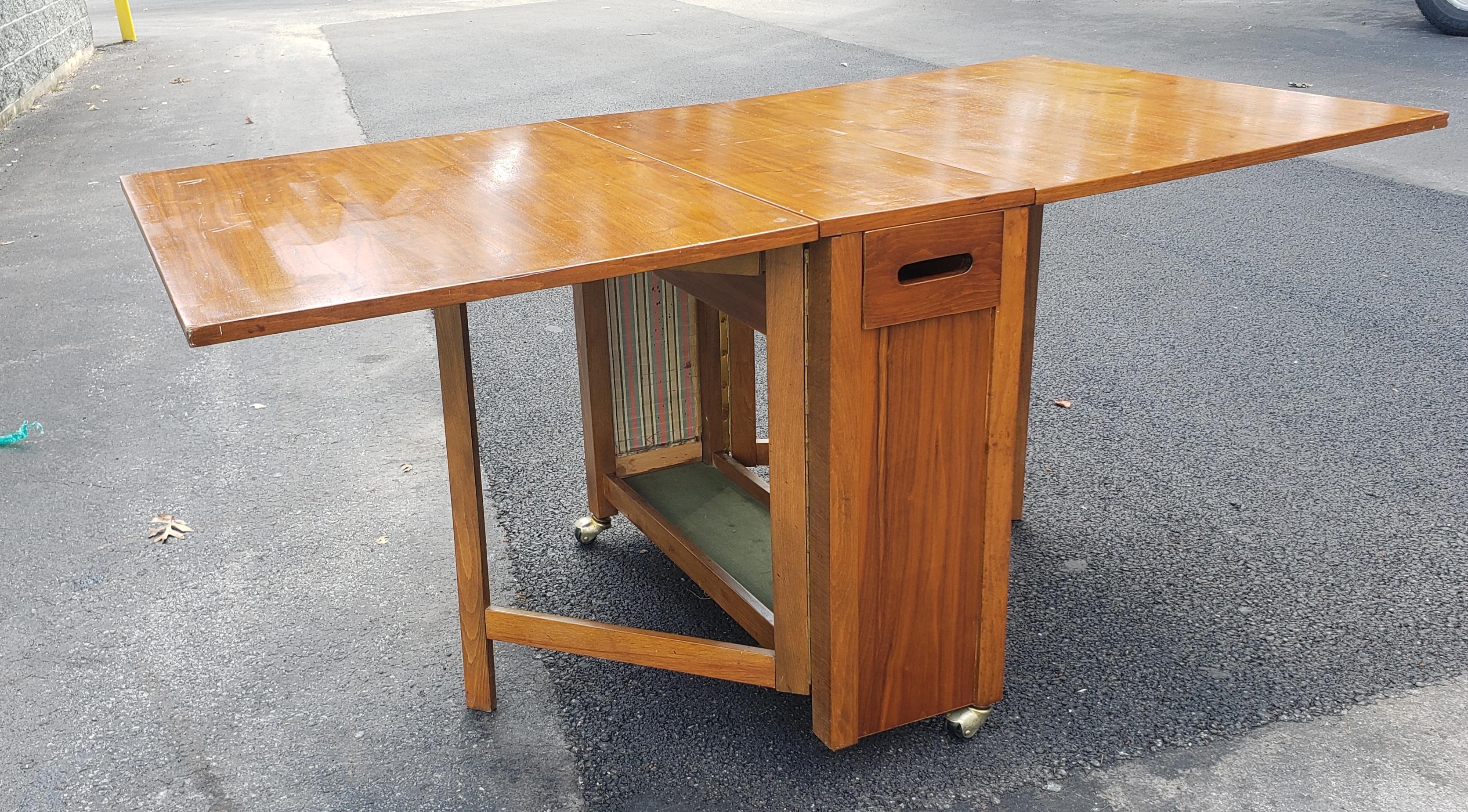 Stained Mid-Century Danish Modern Teak Drop-Leaf Dining Table with Storage on Rollers For Sale