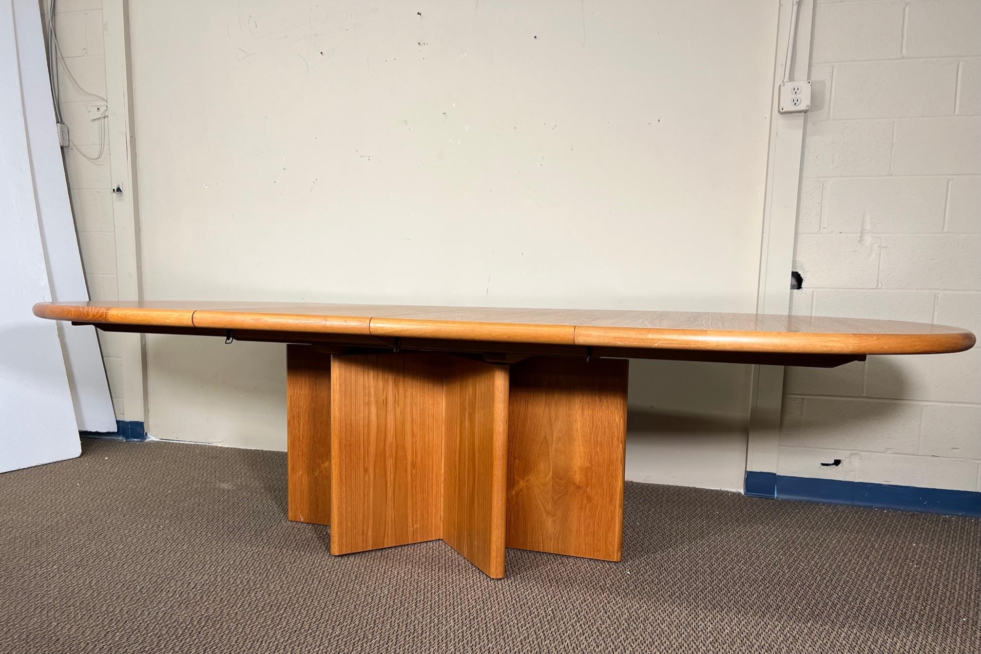This is a Danish teak dining table with 2 leaves. Leaves can be stored inside the table when not in use. The table can be extended with one or with both leaves. It seats 10 people comfortably when fully extended. Excellent condition with minor signs