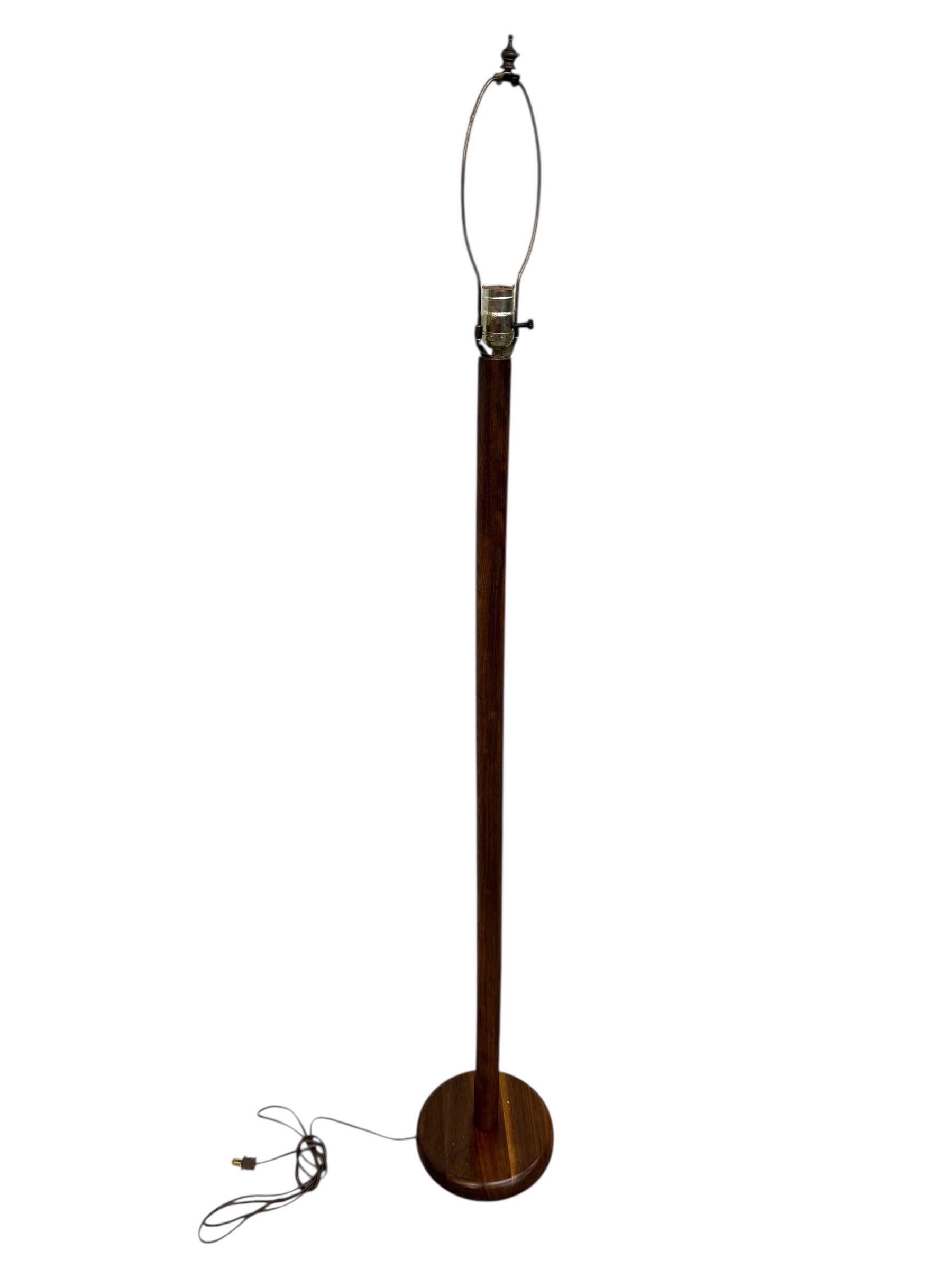 This listing is for a Mid-Century Danish Modern Teak Floor Lamp. Featuring solid teak wood construction, round base, brass harp, and original cord. This is an exceptional combination of quality and Danish design! 