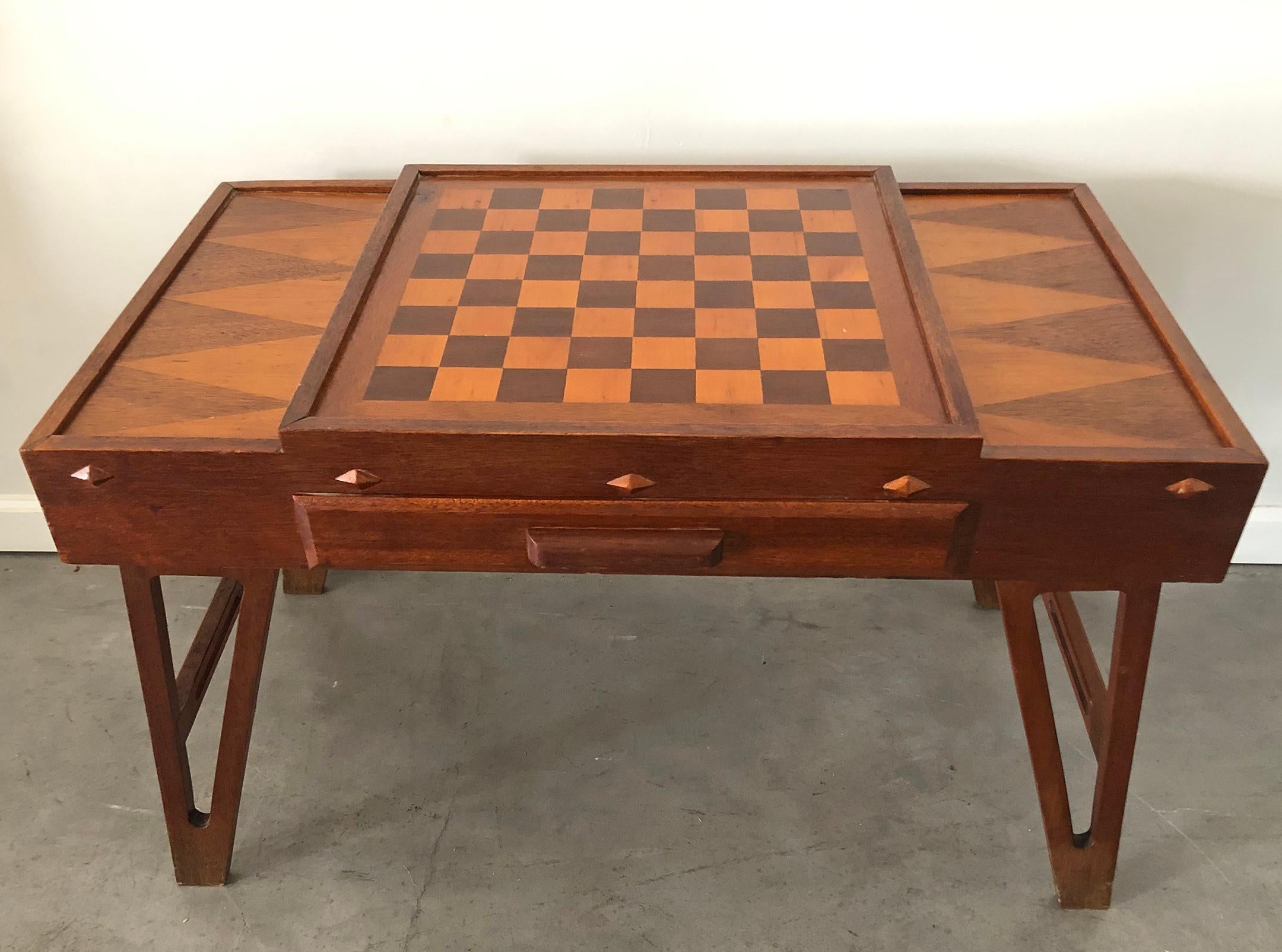 This vintage game table is simply stunning. The table features an integrated chess board / checkerboard design with 2 drawers on both sides. Clean lines, and beautifully detailed legs make this a timeless piece of modern design.

This unique Danish
