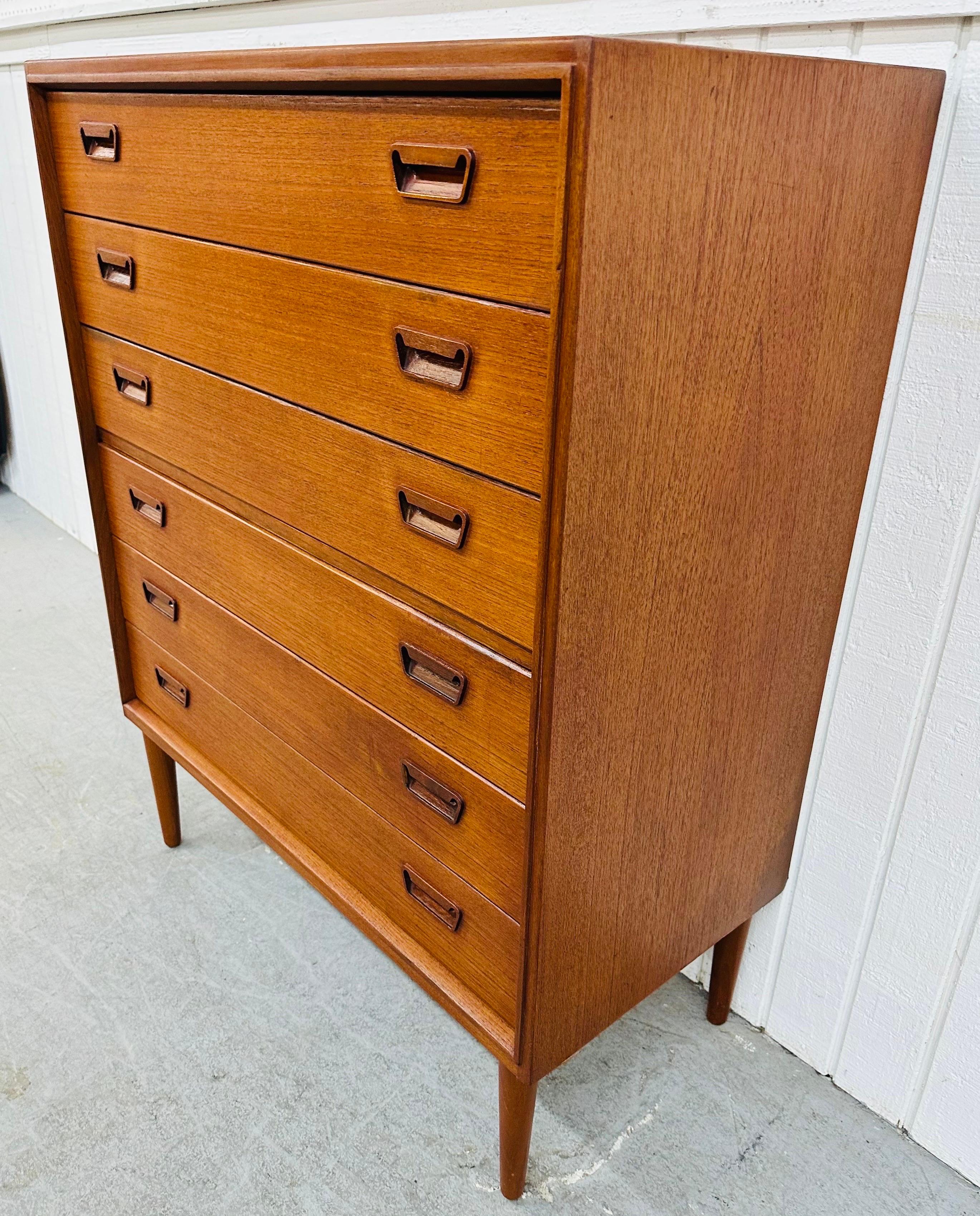 This listing is for a Mid-Century Danish Modern Teak High Chest. Featuring a straight line design, six drawers for storage, wooden pulls, and a beautiful teak finish. This is an exceptional combination of quality and design from Denmark!