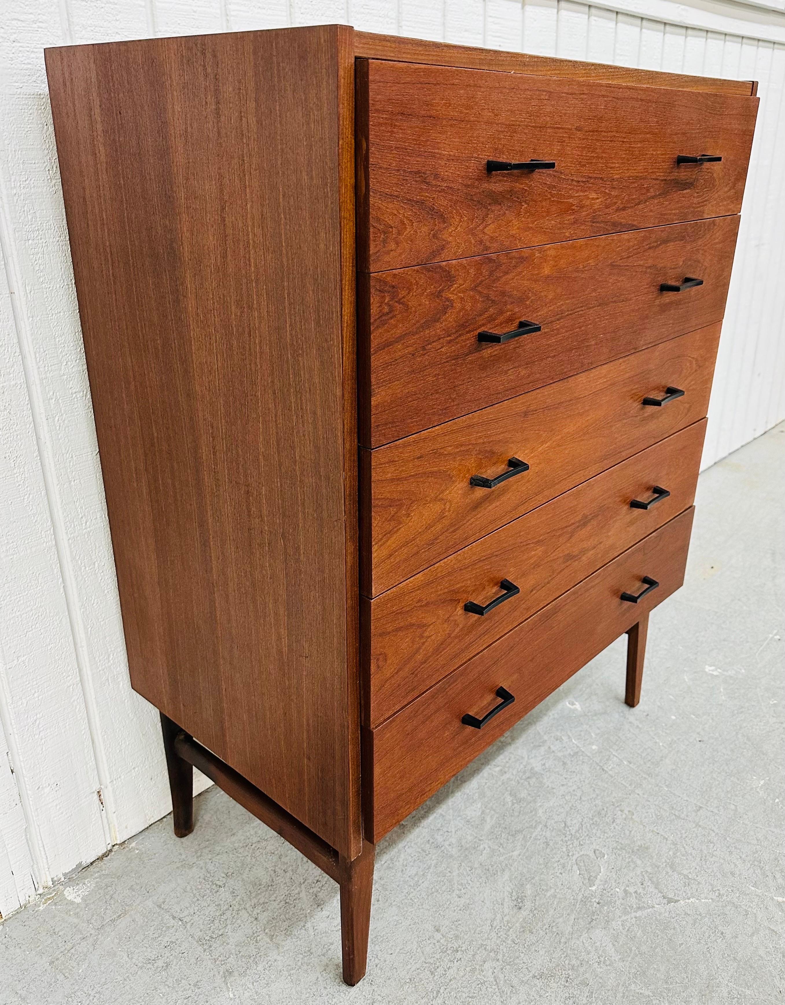 This listing is for a Mid-Century Modern Teak High Chest. Featuring a straight line design, five drawers for storage, original black metal pulls, modern legs, and a beautiful walnut finish. This is an exceptional combination of quality and design!