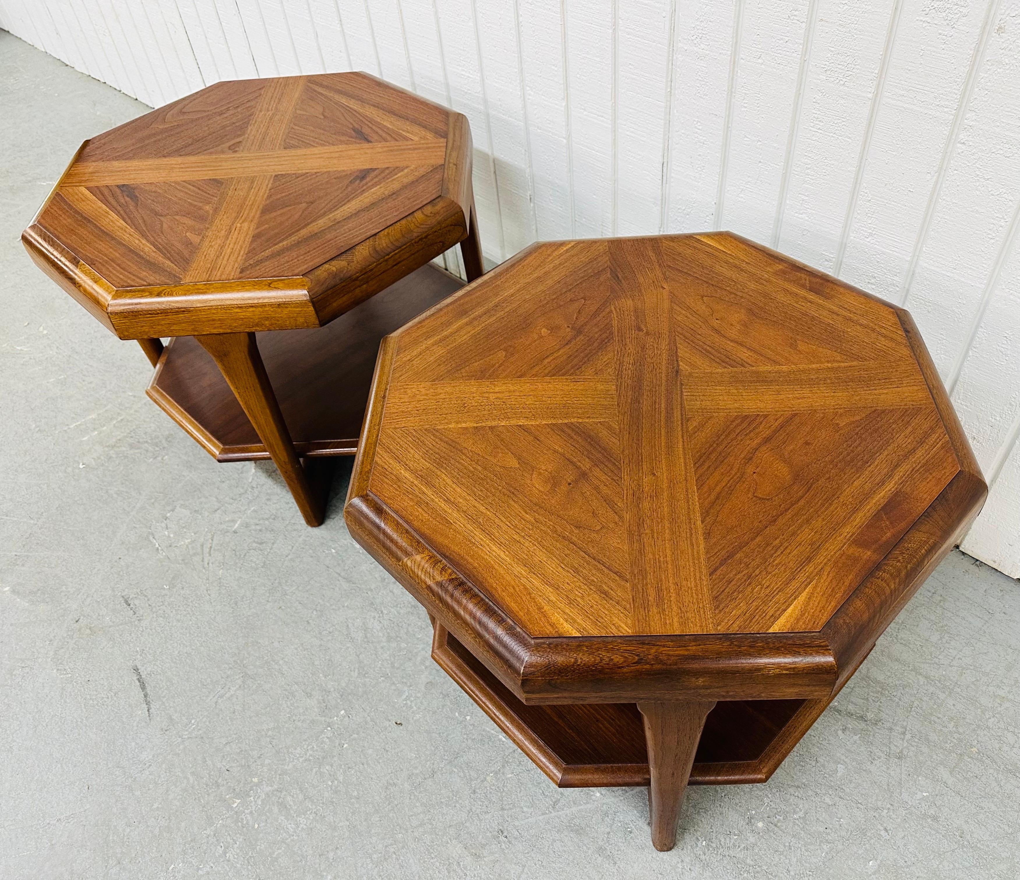 This listing is for a pair of Mid-Century Modern Lane Octagonal Walnut Side Tables. Featuring a two-tier octagonal design, modern legs, and a beautiful walnut finish. This is an exceptional combination of quality and design by Lane!
