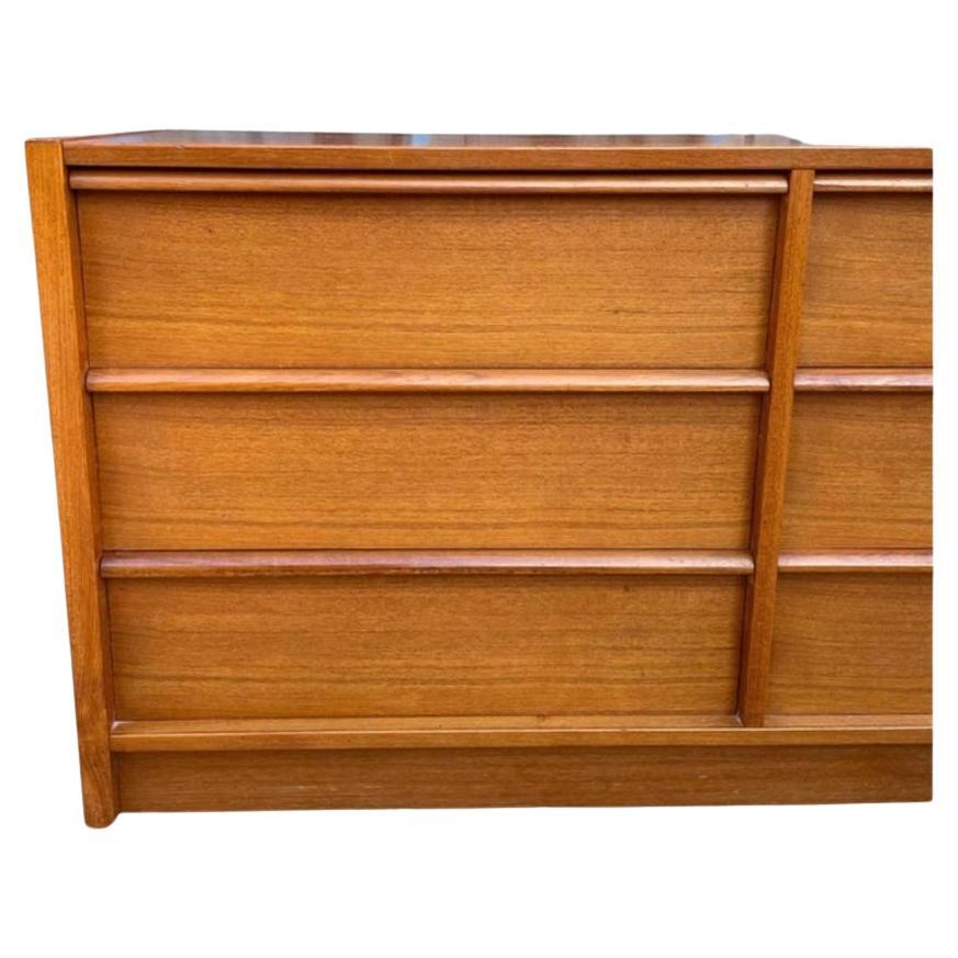 Very clean mid-century Danish modern long and low teak 9 drawer credenza or dresser. All drawers slide smooth. Beautiful teak grain. Very clean inside and out. Dovetail joints on drawers. Made In Denmark labeled. Located in Brooklyn NYC.

Measures
