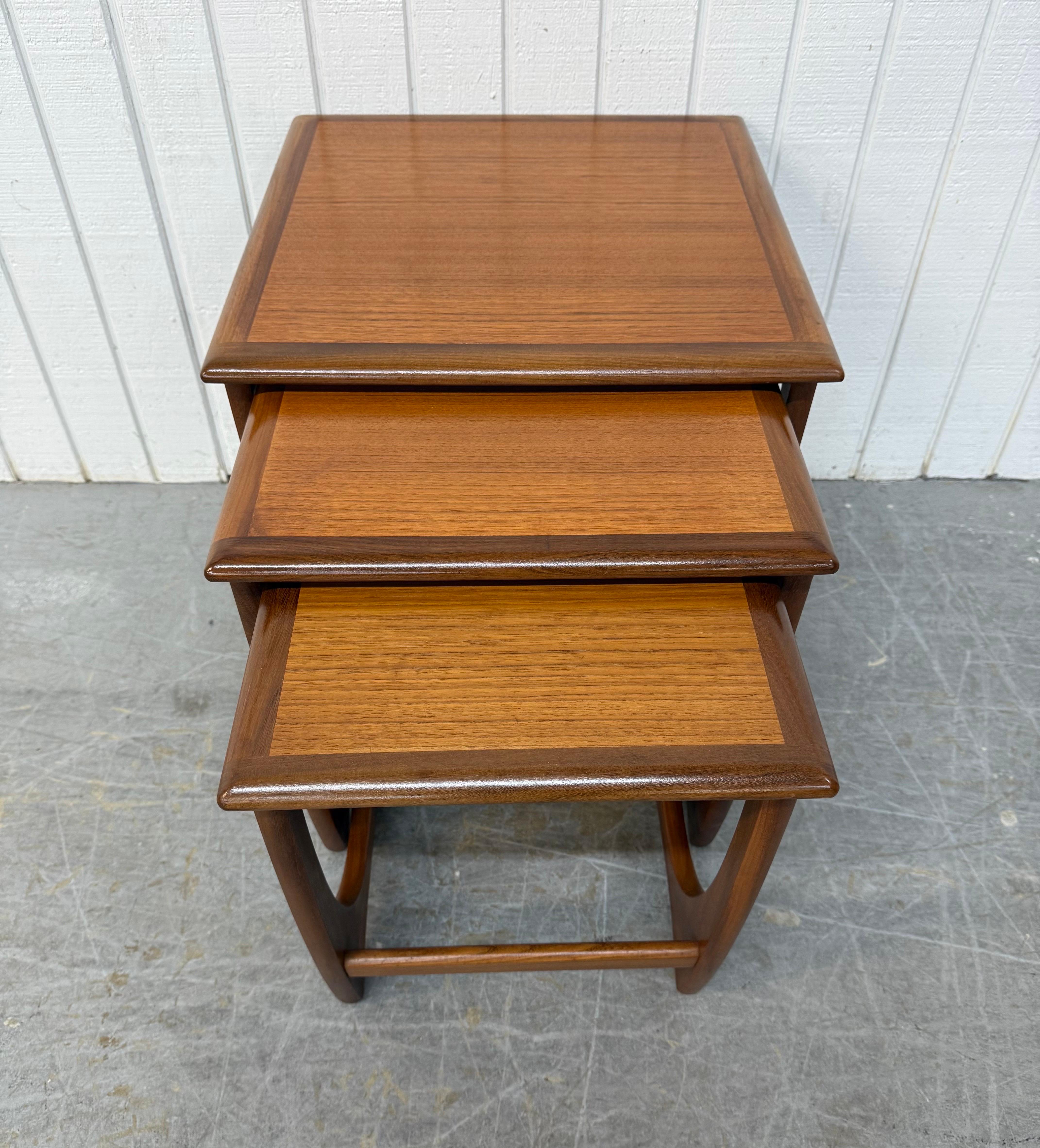 This listing is for a set of three Mid-Century Danish Modern Nesting Tables. Featuring a square top, sculpted modern legs, and a beautiful teak finish. This is an exceptional combination of quality and Danish design!