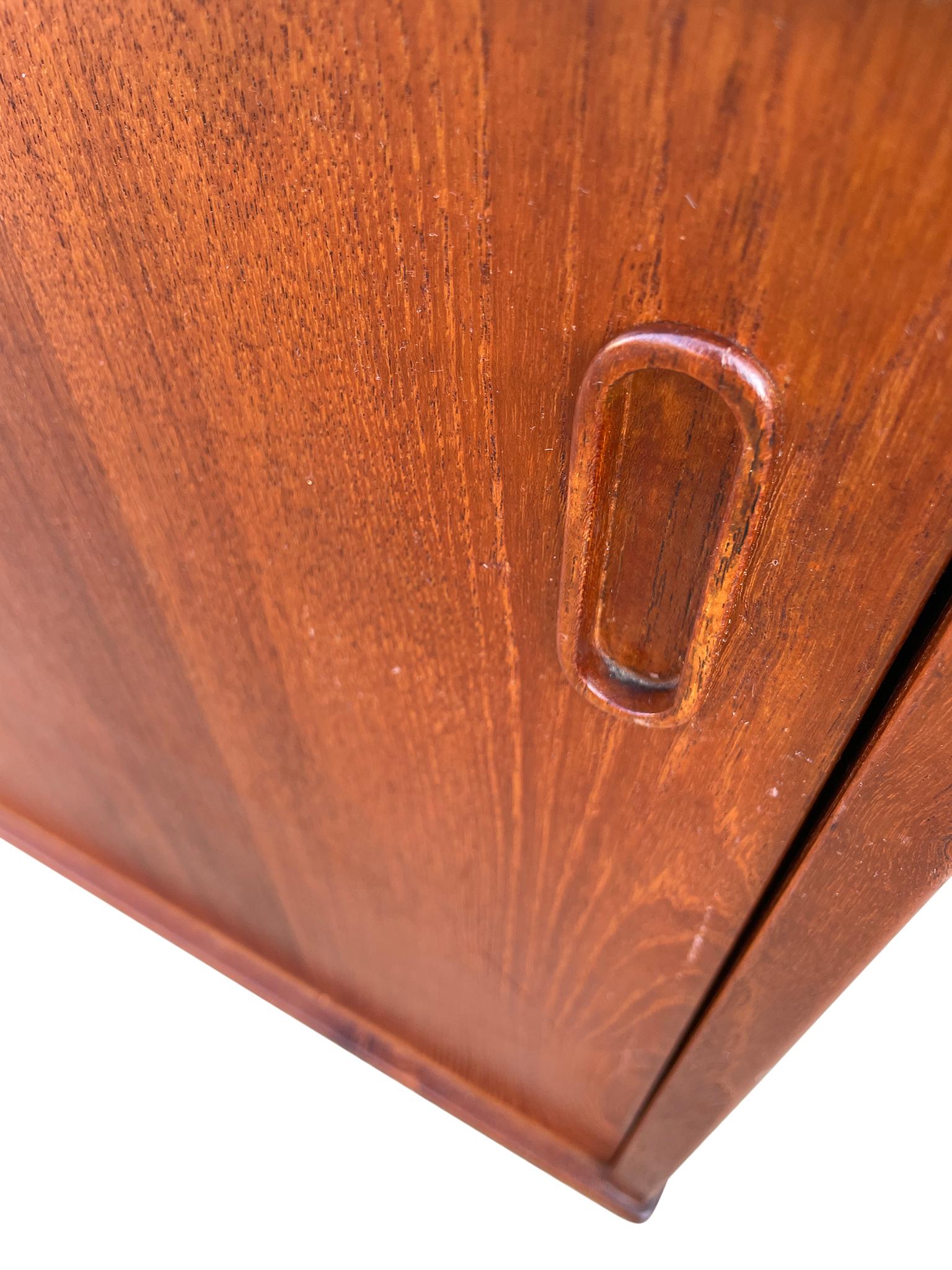 Teak Mid century Danish modern teak sliding door credenza by Dyrlund