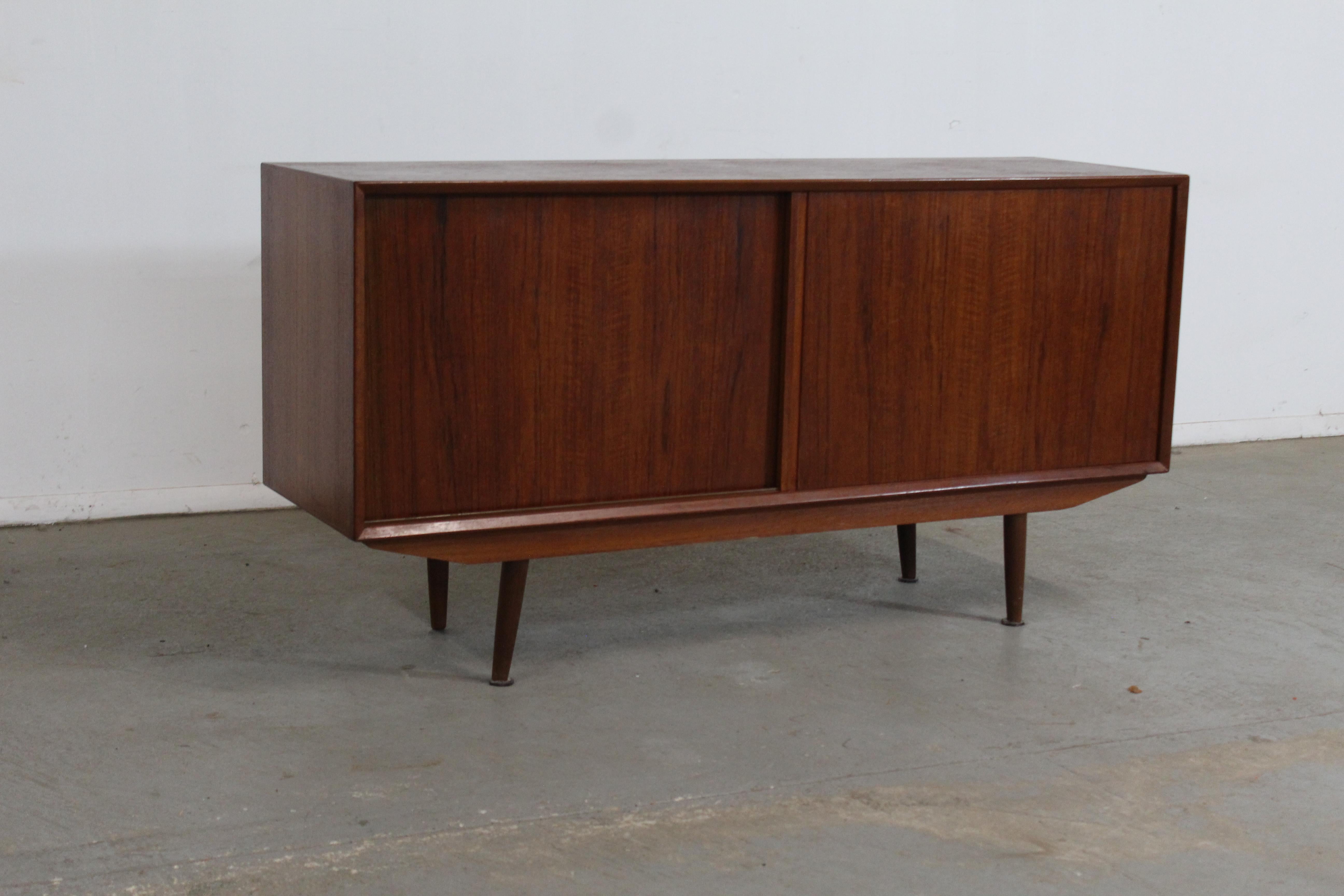 Mid-Century Danish Modern Teak Credenza

Offered is a teak credenza. This piece makes a statement and will make a nice feature piece in any room. The credenza is made of teak and is highly functional with plenty of storage. Features pencil legs,