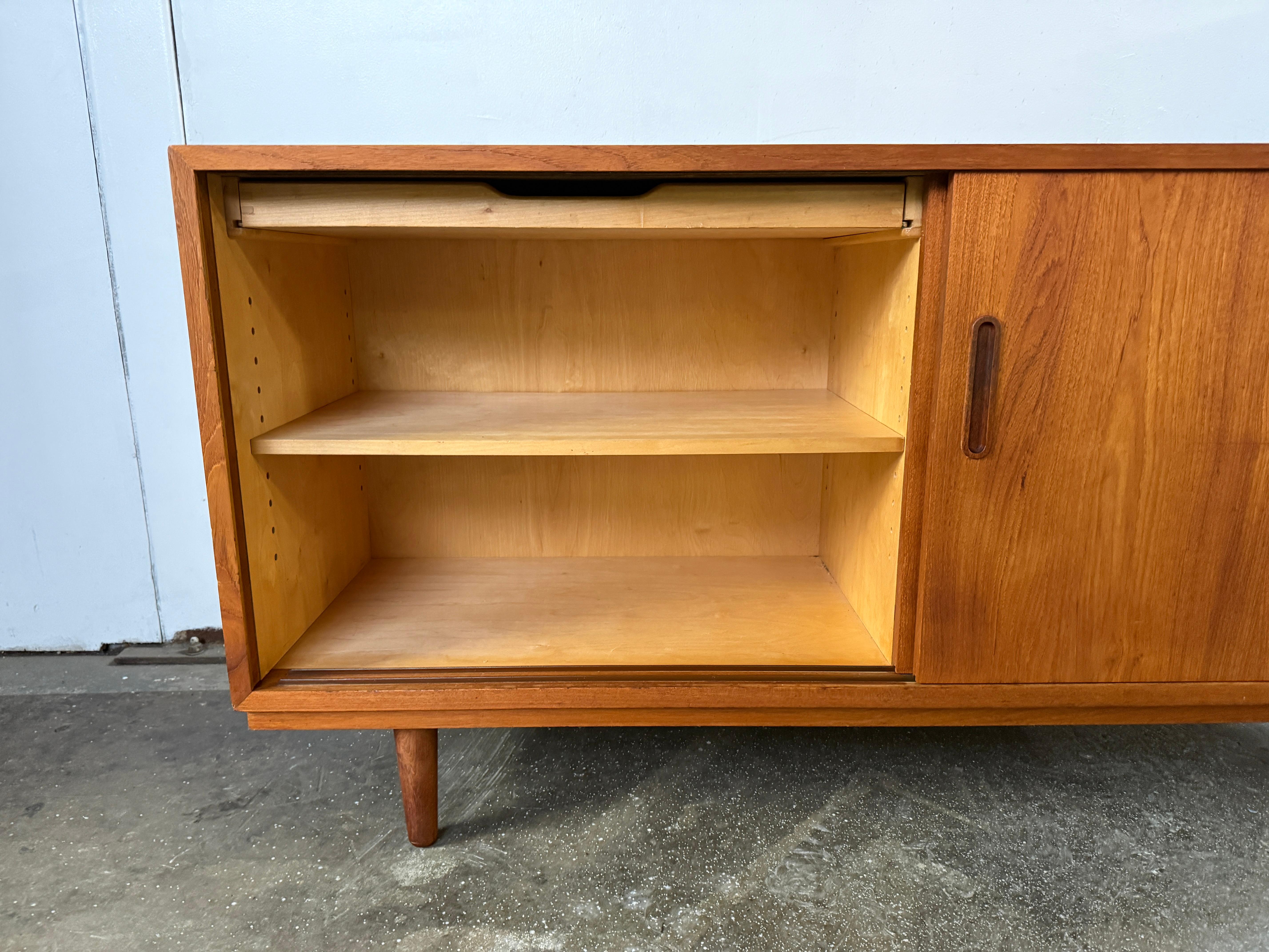 Woodwork Mid century Danish Modern teak Sliding Door Credenza Sideboard on Tapered Legs
