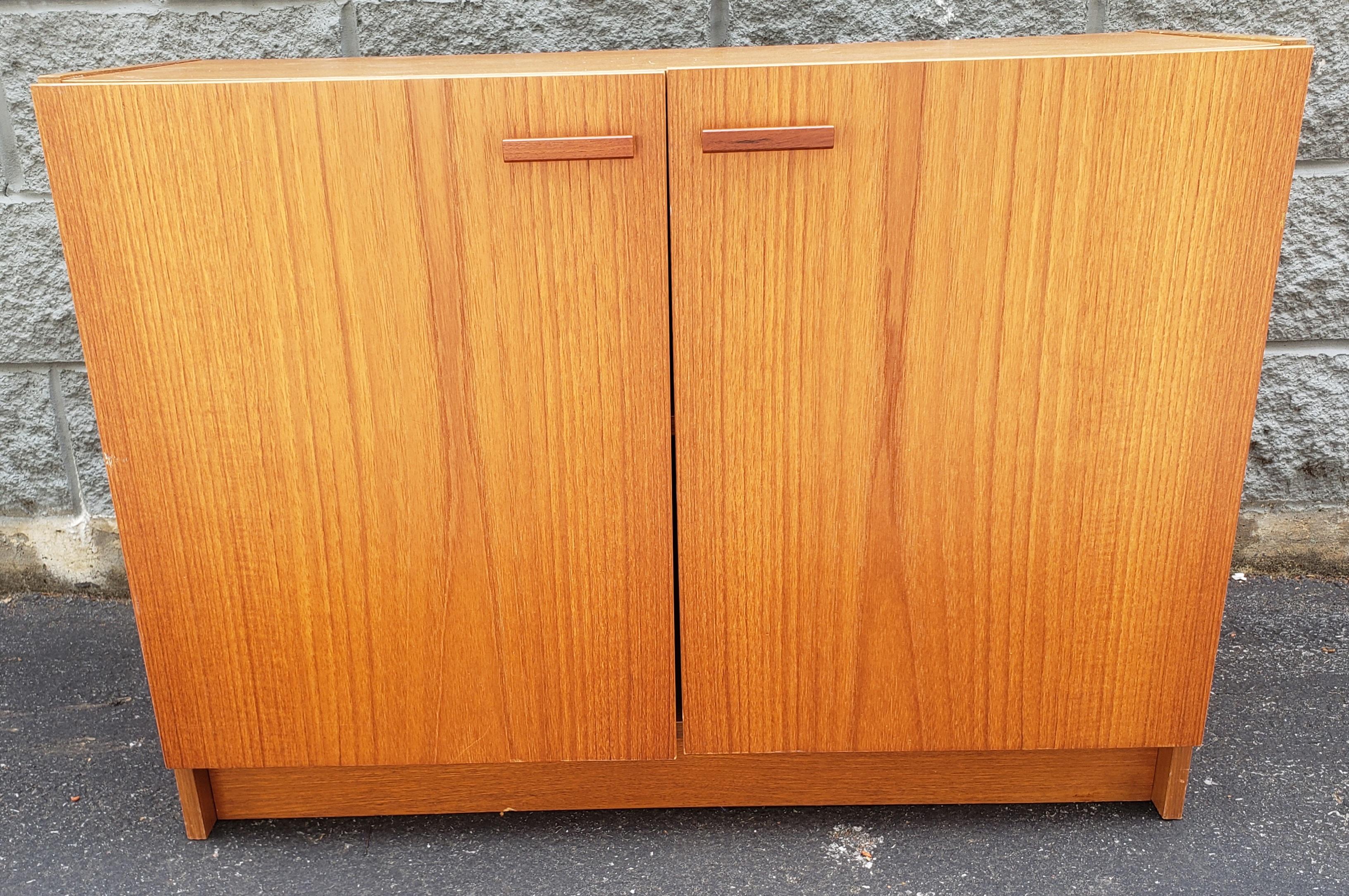 A Mid-Century Danish Modern Teak Storage Cabinet in good vintage condition. Measures 35.5