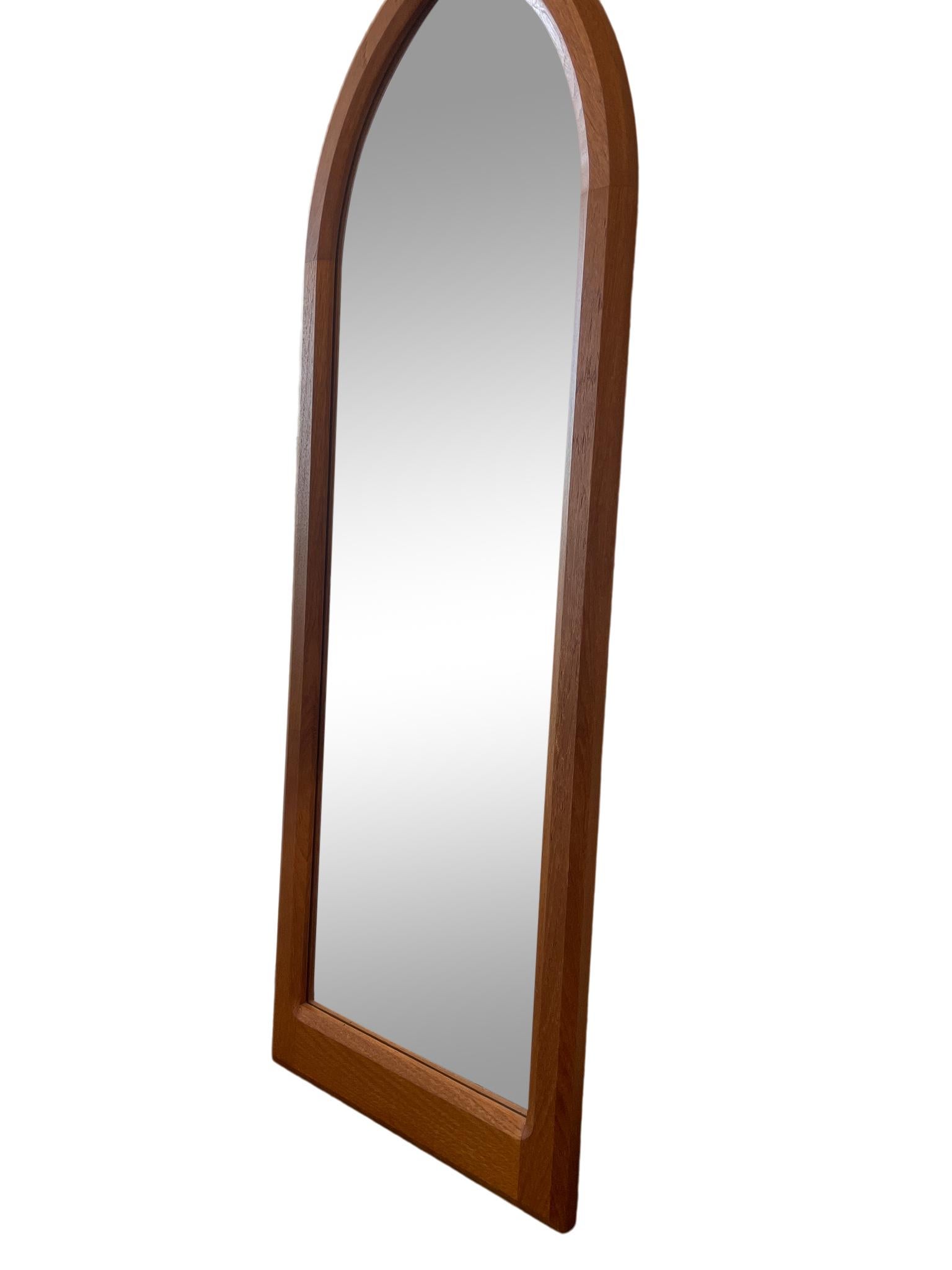 Mid Century Danish modern teak wall mirror unique Gothic arch shape original vintage condition. Made in Denmark. Located in Brooklyn NYC.

Measures: 17