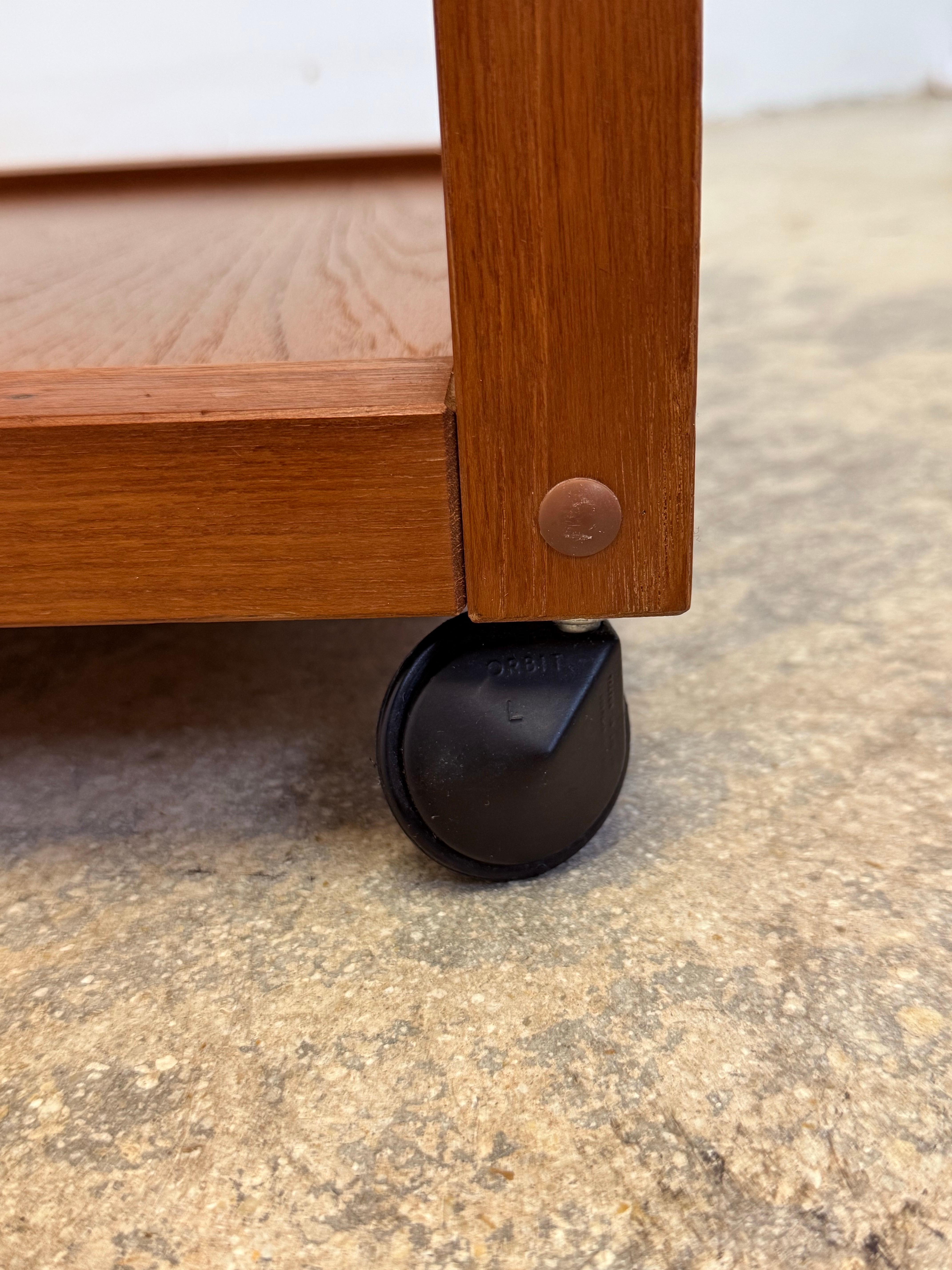 Mid-Century Danish Modern Teak Wood Rolling End Table With Magazine or Book Hold For Sale 4