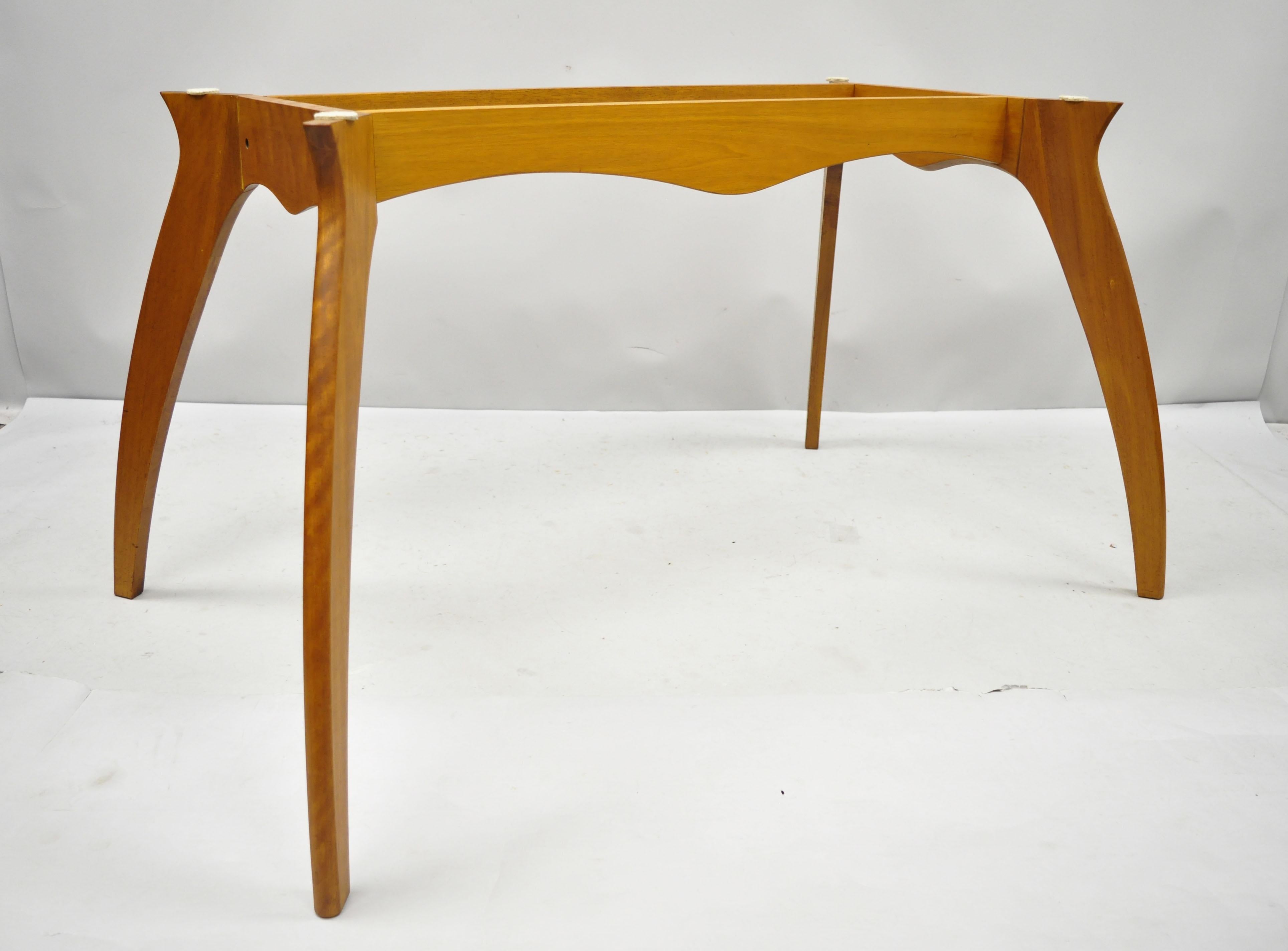 Mid Century Danish modern teak wood sculptural dining room table base. Item can be disassembled for shipping, solid wood frame, beautiful wood grain, tapered legs, sleek sculptural form, base only. Does not include top.
Age: Mid-late 20th