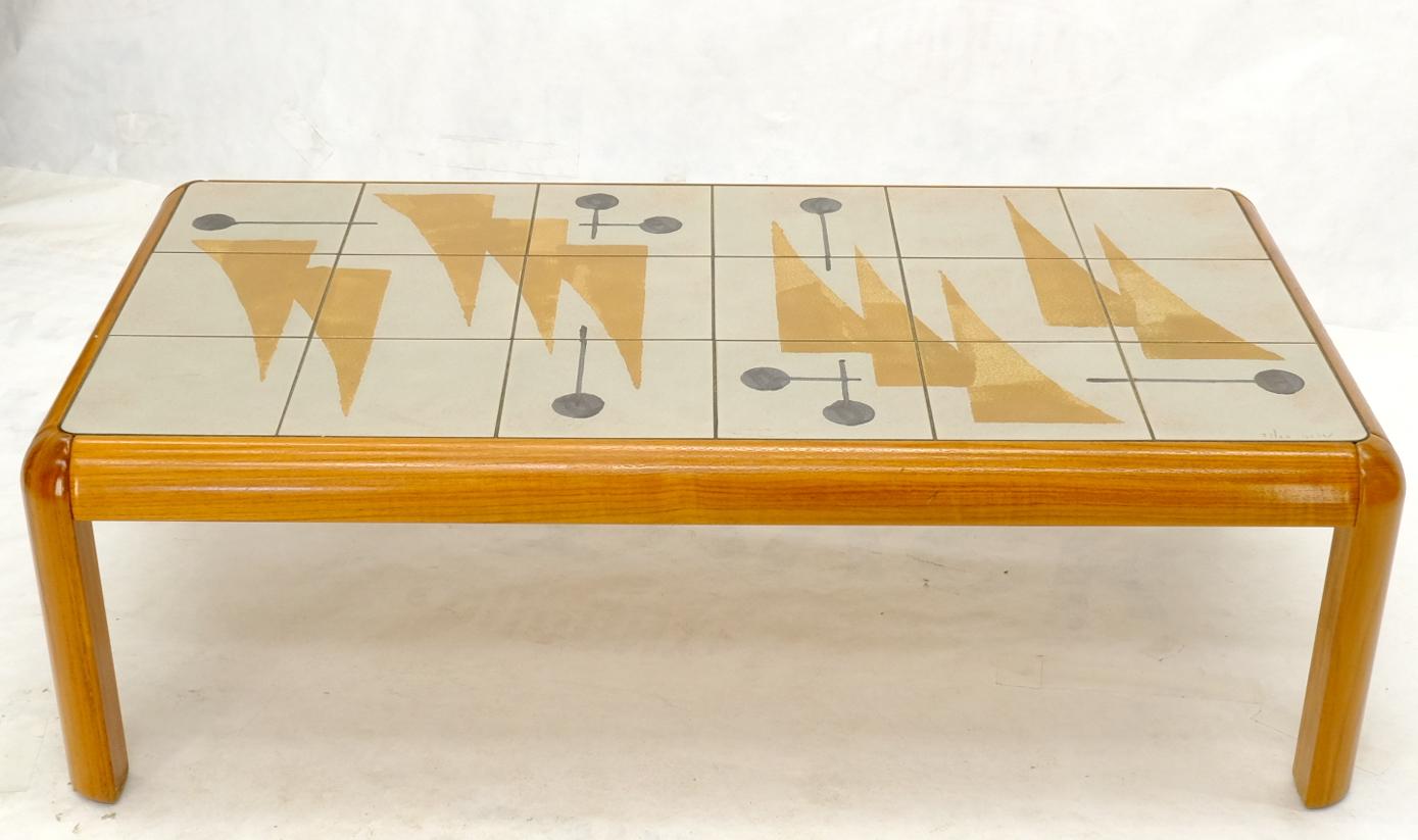 Mid-Century Modern tile solid teak frame coffee table. Artist signed sail boat scene in tiles. Made in Denmark.