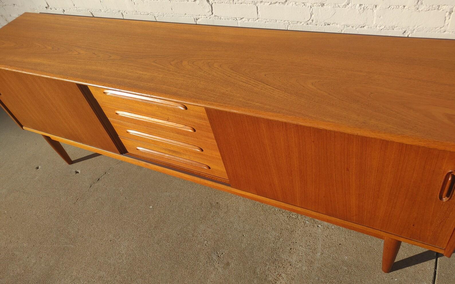 Mid Century Danish Modern Troeds Sideboard

Above average vintage condition and structurally sound. Has some expected slight finish wear and scratching. Has some scratching on front edge. Outdoor listing pictures might appear slightly darker or more