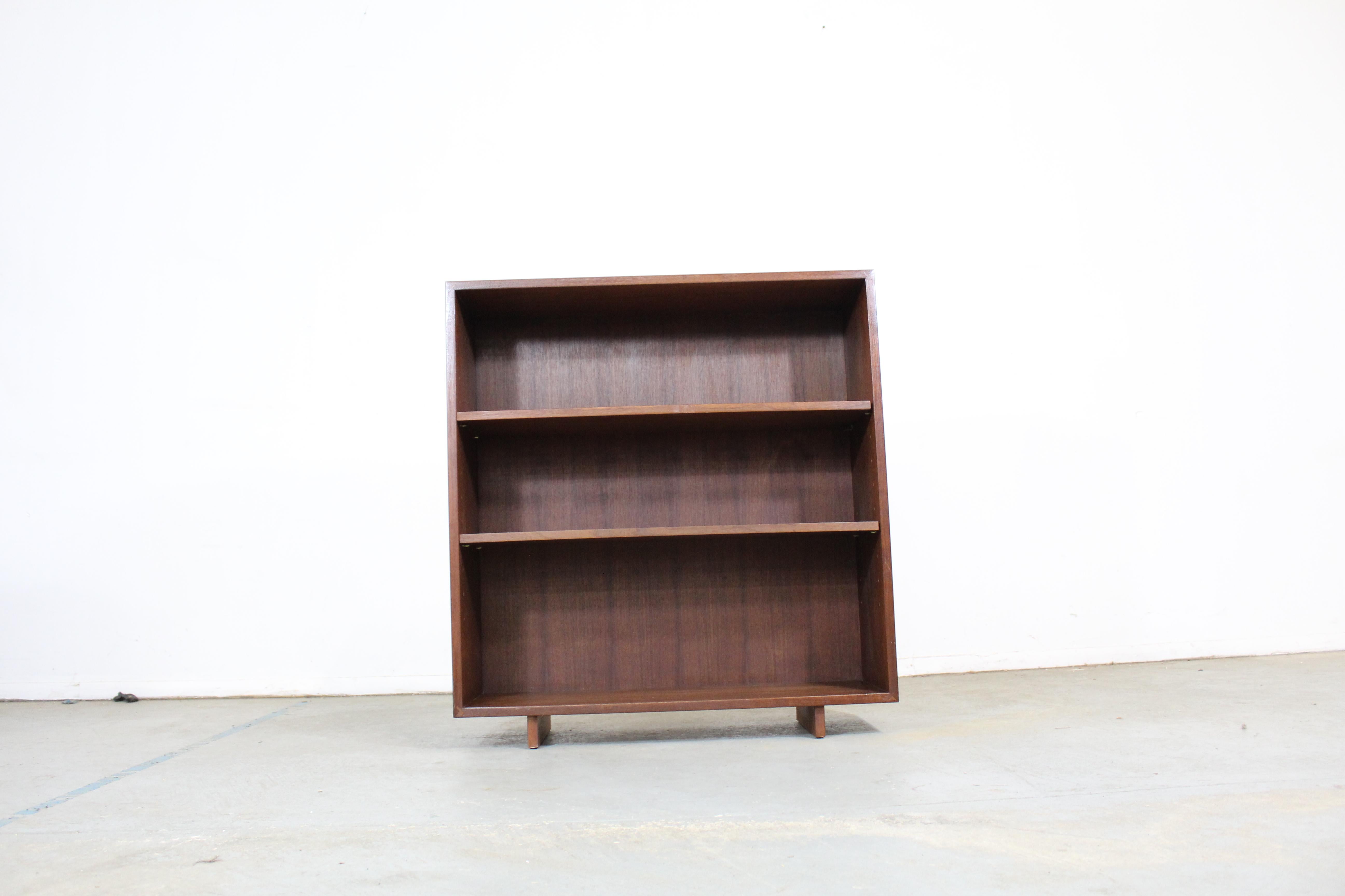 Danish modern walnut shelving unit

Offered is a Danish modern walnut shelving unit. It has three shelving sections which can be pulled apart with ease and adjusted. It is structurally sound with some minor fading and scratches in the wood. It has