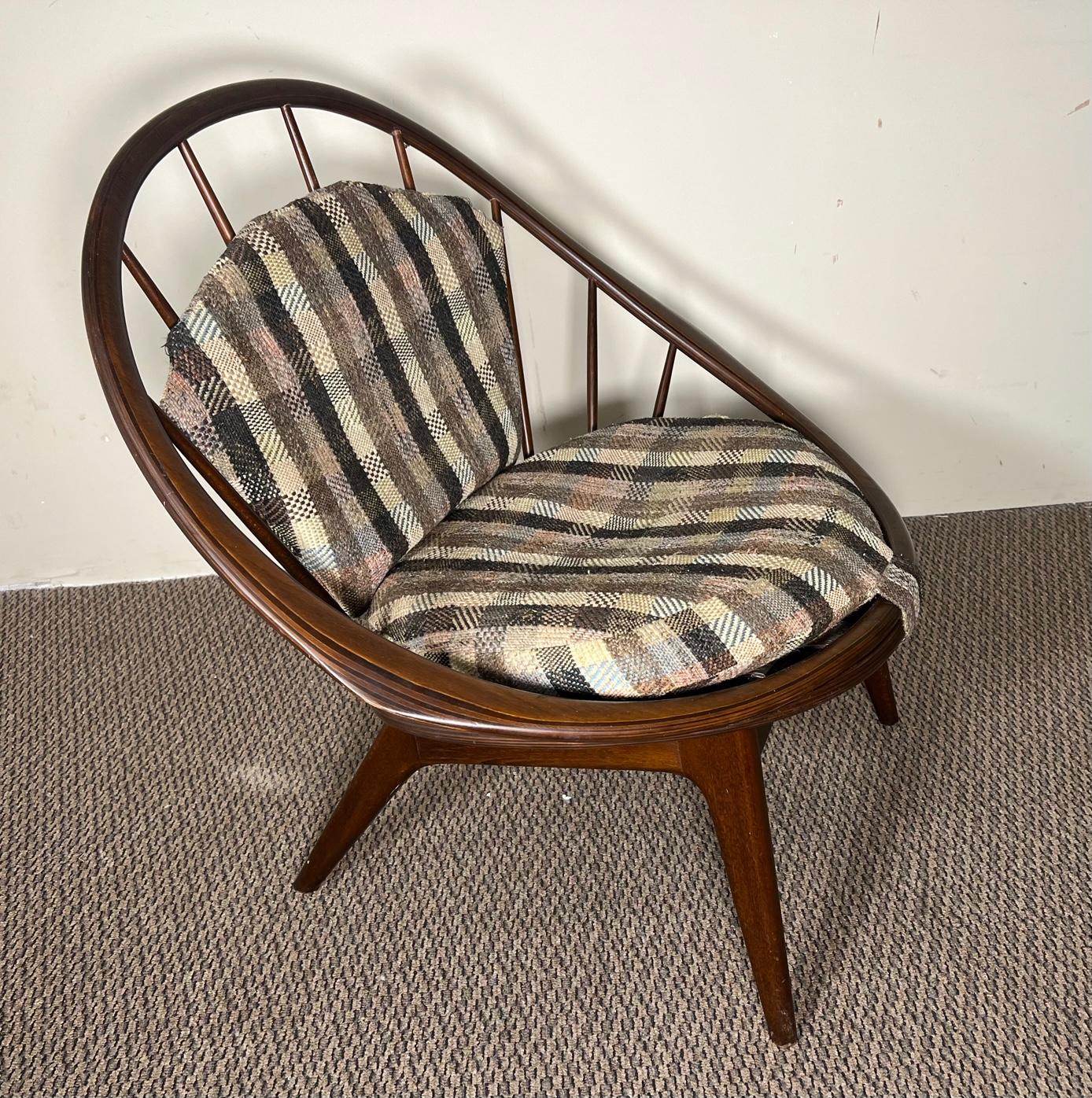 Mid century modern walnut lounge chair by Kofod Larsen for Selig. Model Peacock chair. Original label underneath the chair. Upholstery appears to be original and is in need of replacement. Straps on back cushion missing. Wood frame is in very nice