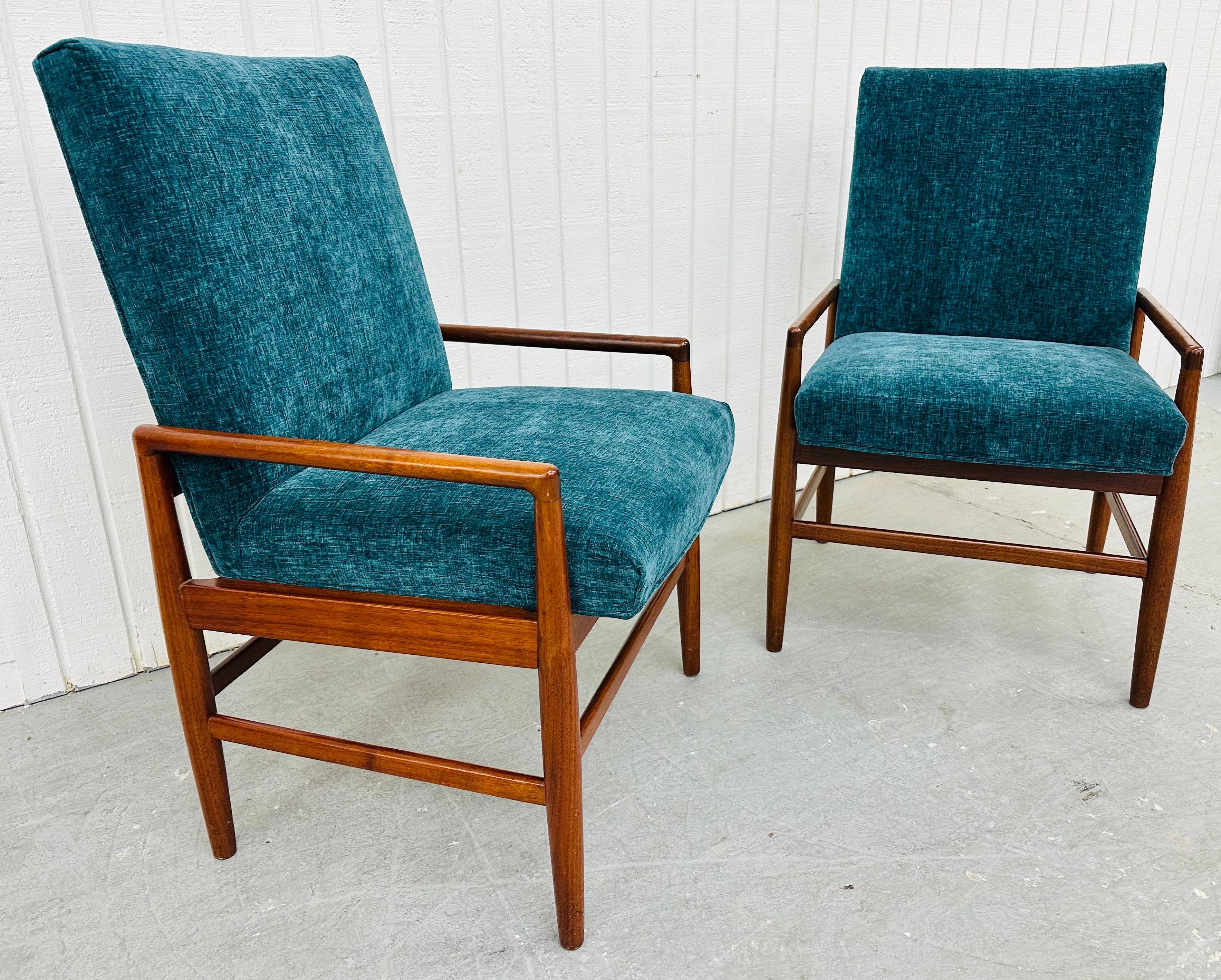 This listing is for a pair of Mid-Century Danish Modern Walnut Lounge Chairs. Featuring a straight line design, newly upholstered body, wooden frames, and a beautiful walnut finish. This is an exceptional combination of quality and Danish design!