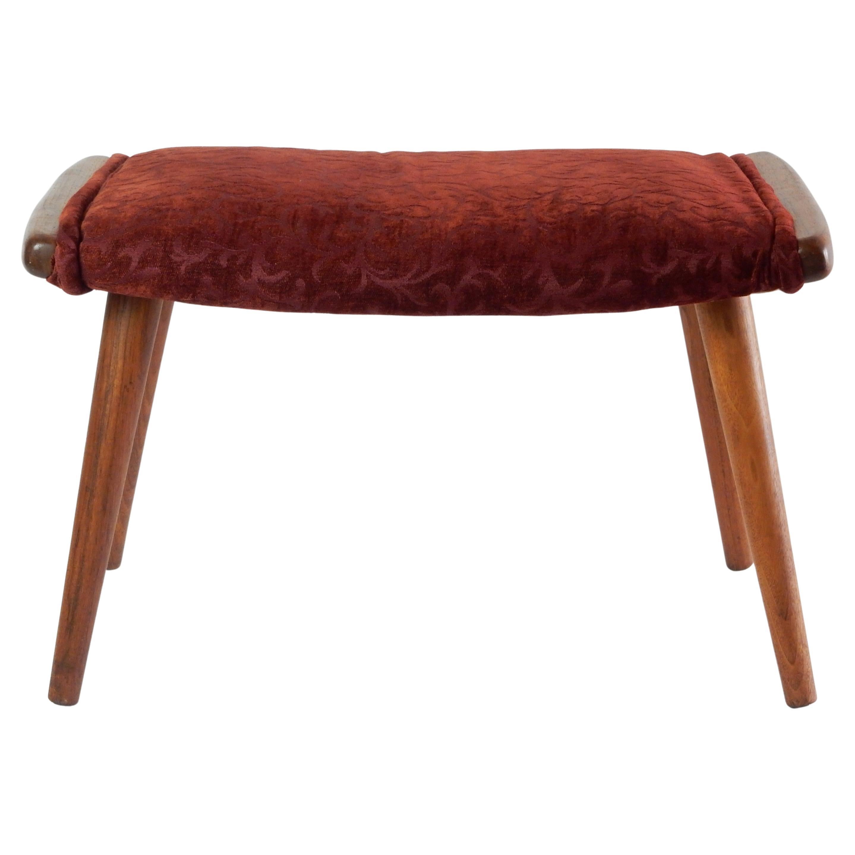 Mid Century Danish Modern Walnut chair ottoman, similar to Hans Wegner design chair ottomans minus the hand hold sides.
Circa 1950's, this piece shows it was well cared for
and reupholstered at some point.


