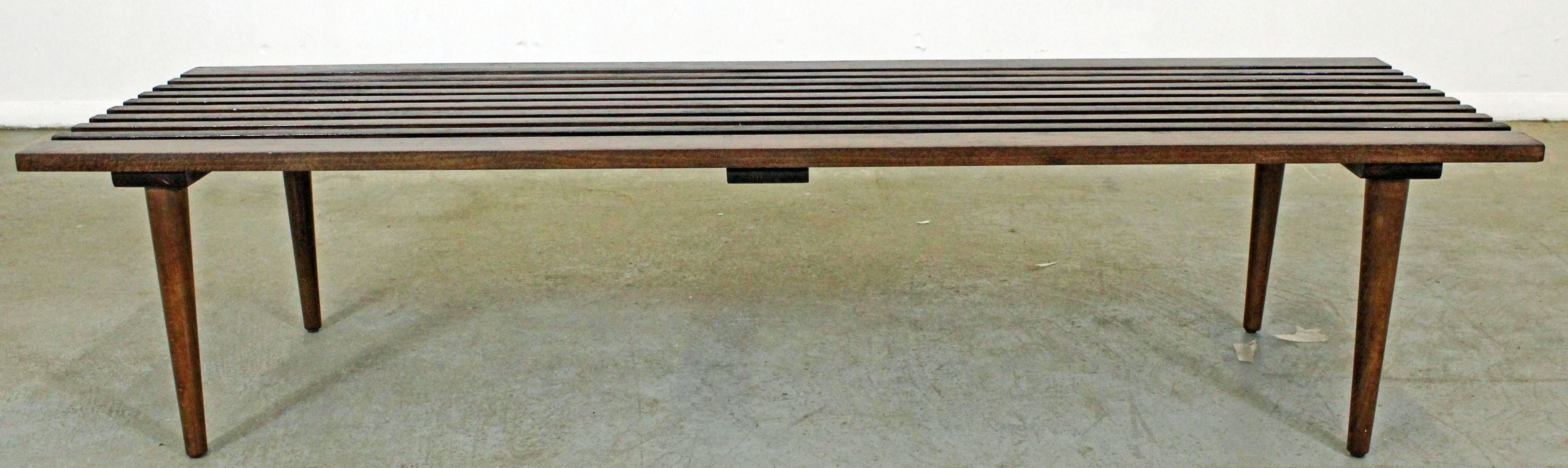 Offered is a Mid-Century Modern walnut slat bench coffee table. It is in excellent condition, has been refinished. It is not signed. Check out our other listings for more vintage, primitive and antique pieces. 

Dimensions: 
60