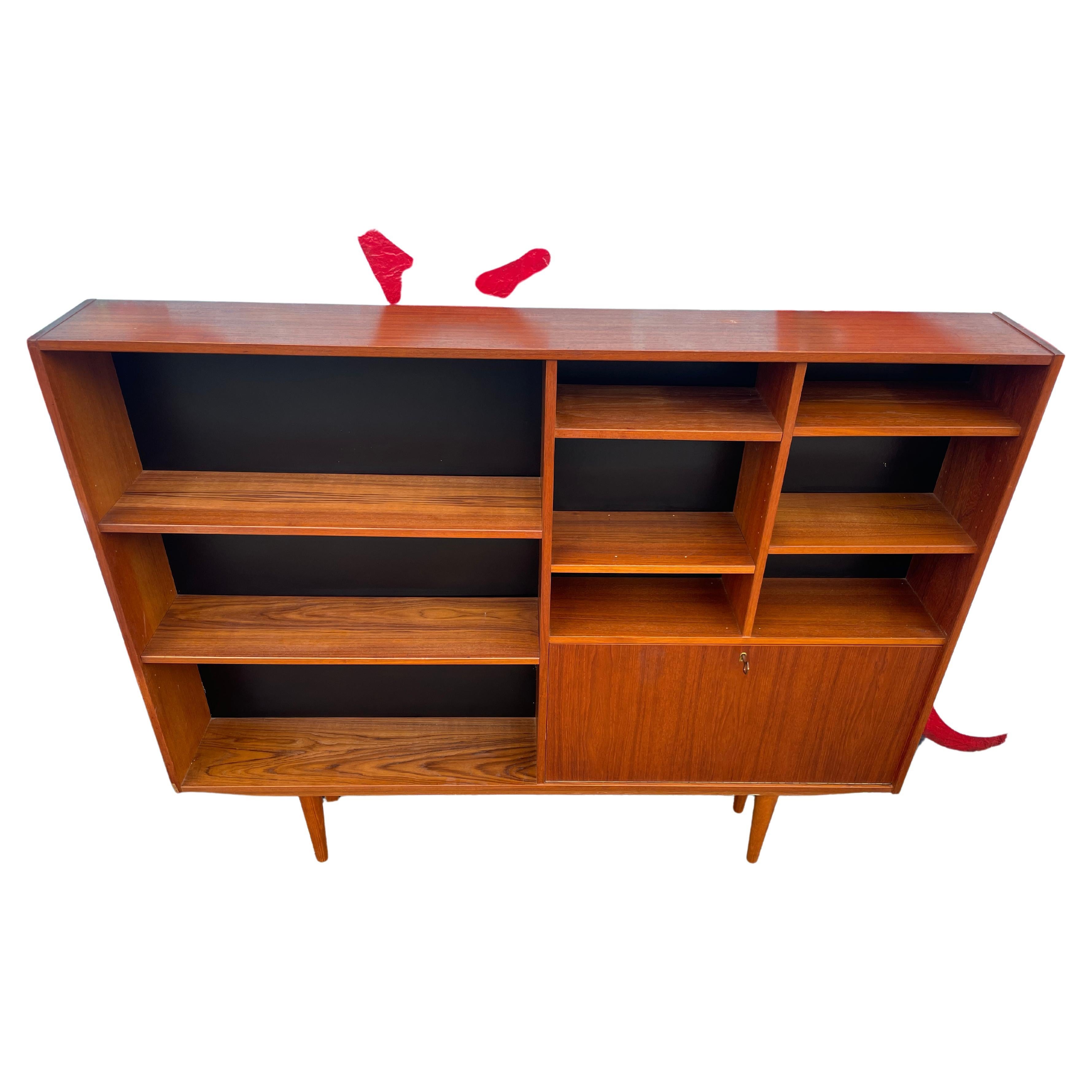 Mid-Century Danish Modern Wide Slim Bookcase with Lower Storage Unit with Key In Good Condition In BROOKLYN, NY