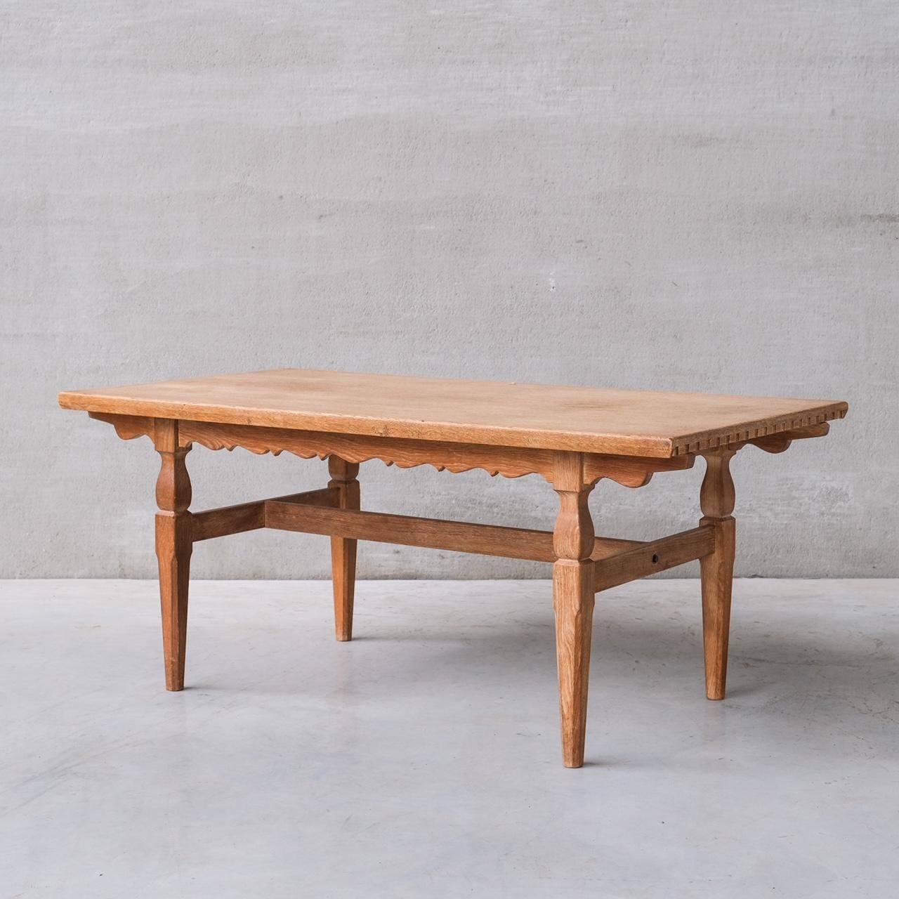 An oak dining table attr. to Henning (Henry) Kjaernulf.

Denmark, c1960s.

Two extensions provided which extends to a total of 268 W in cm.

Dimensions below are without the leaves.

Good vintage condition, some scuffs and wear commensurate with