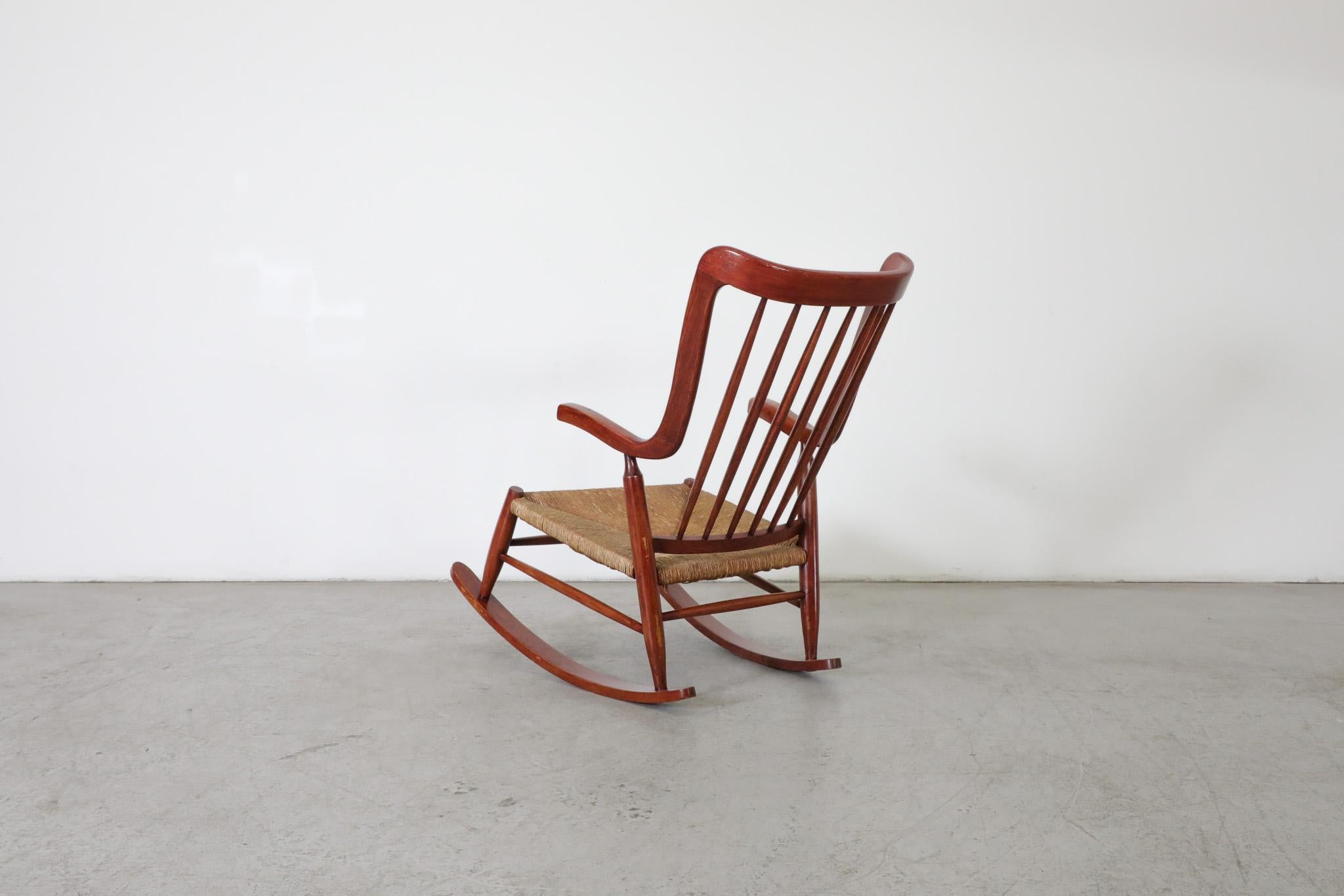 Dutch Mid-Century Danish Organic Curved Back Spindle Back Rocking Chair with Rush Seat For Sale