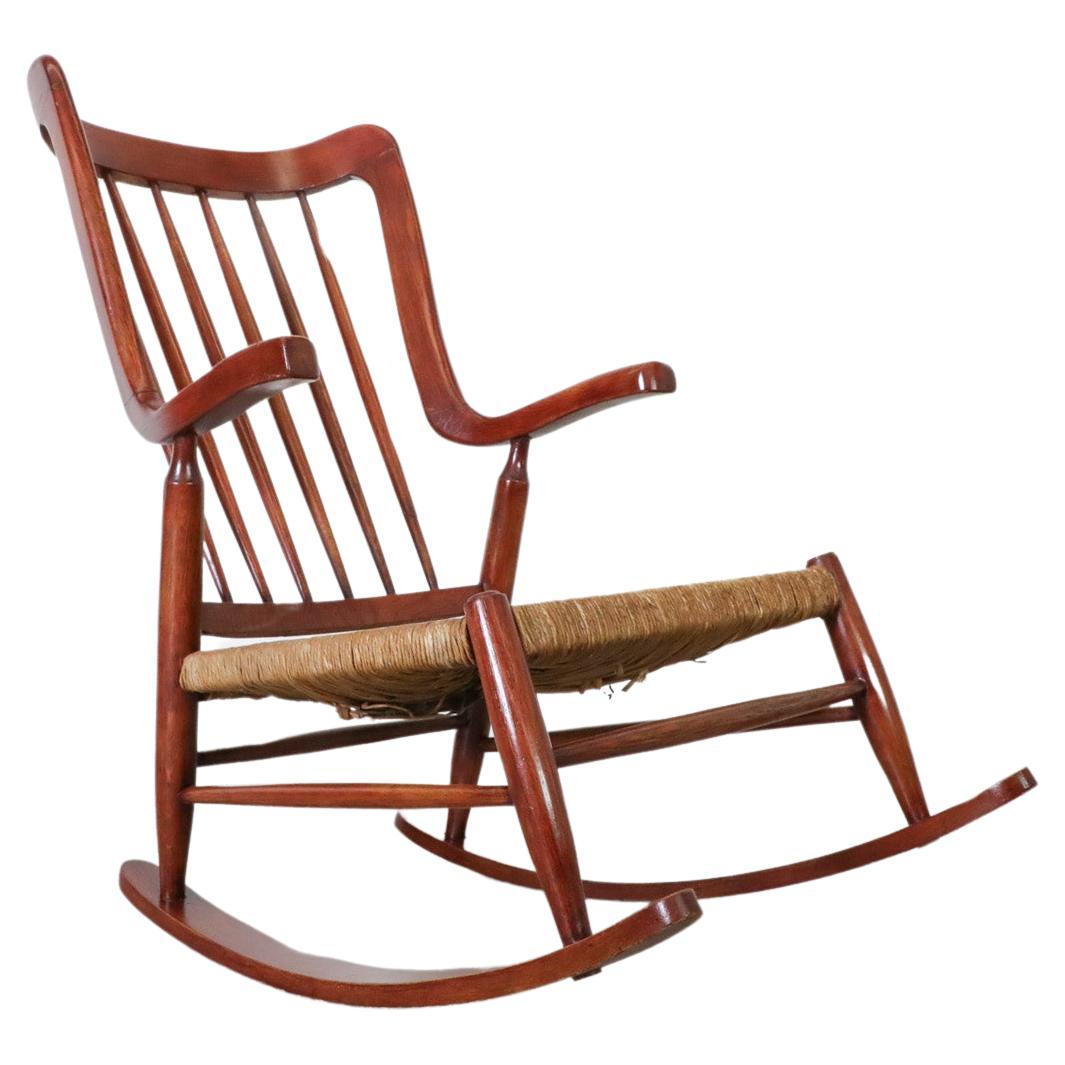Mid-Century Danish Organic Curved Back Spindle Back Rocking Chair with Rush Seat For Sale