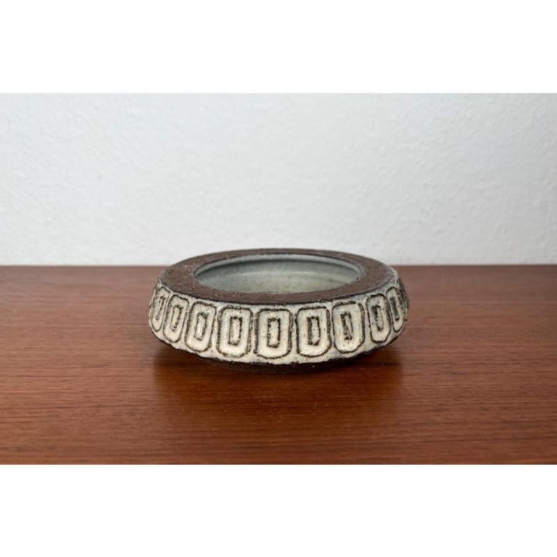 Mid-Century Modern Danish Studio Pottery Bowl by Helge Bjufstrøm for Michael Andersen Keramik, Bornholm, 1960s, in Very Good conditions. Designed 1960 to 1969 This piece has an attribution mark,
Official proof of authenticity such as vintage