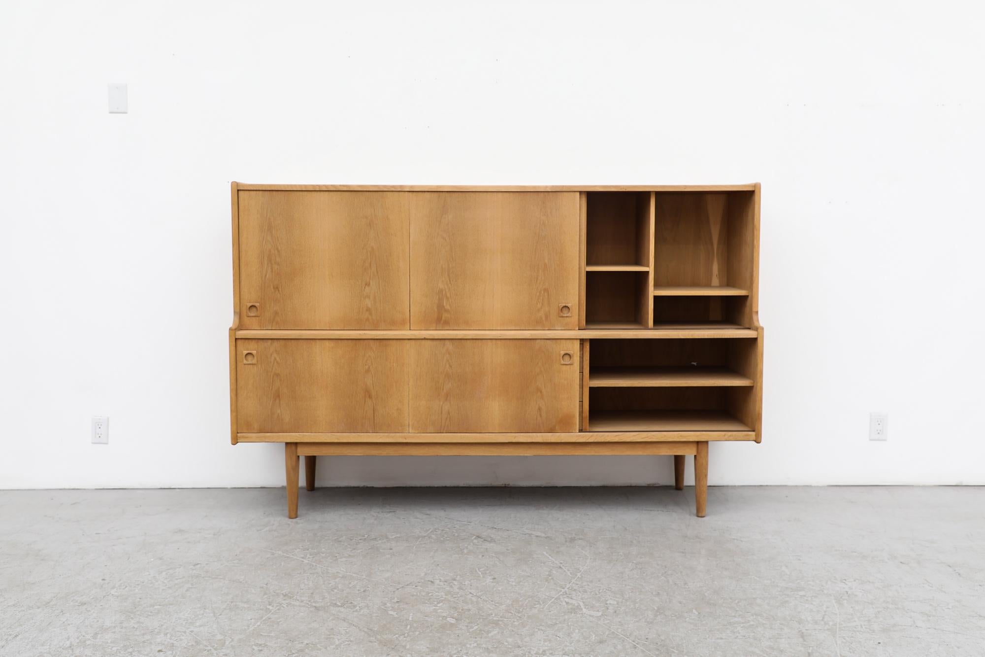 Mid-Century Danish raw oak Highboard by Johannes Andersen, whose while working with oak, teak, mahogany, and rosewood he elevated Scandinavian modernism's emphasis on efficiency and space conservation to new heights.
This piece has been sanded and