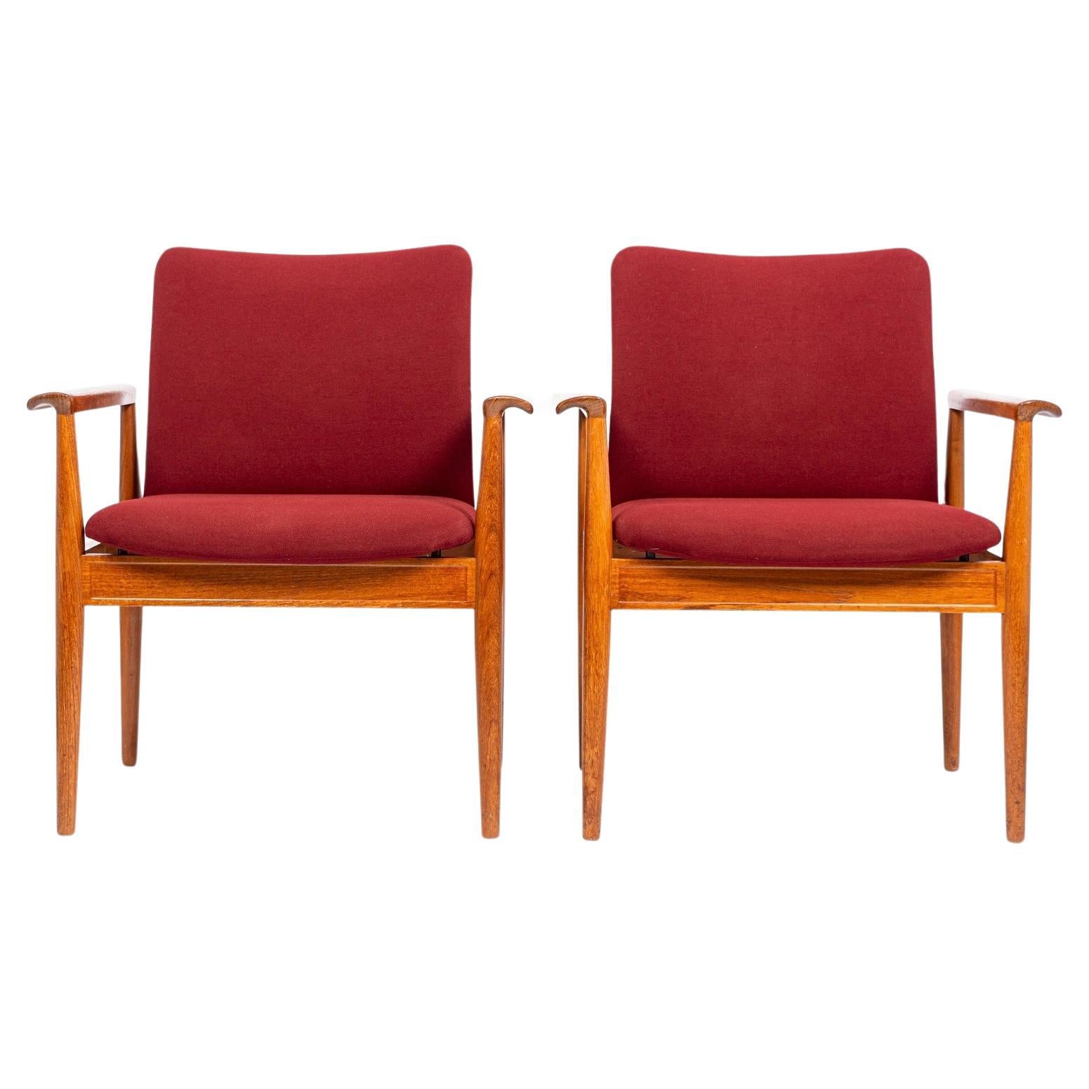 Mid Century Danish Red Lounge Chairs by Finn Juhl for France & Daverkosen For Sale