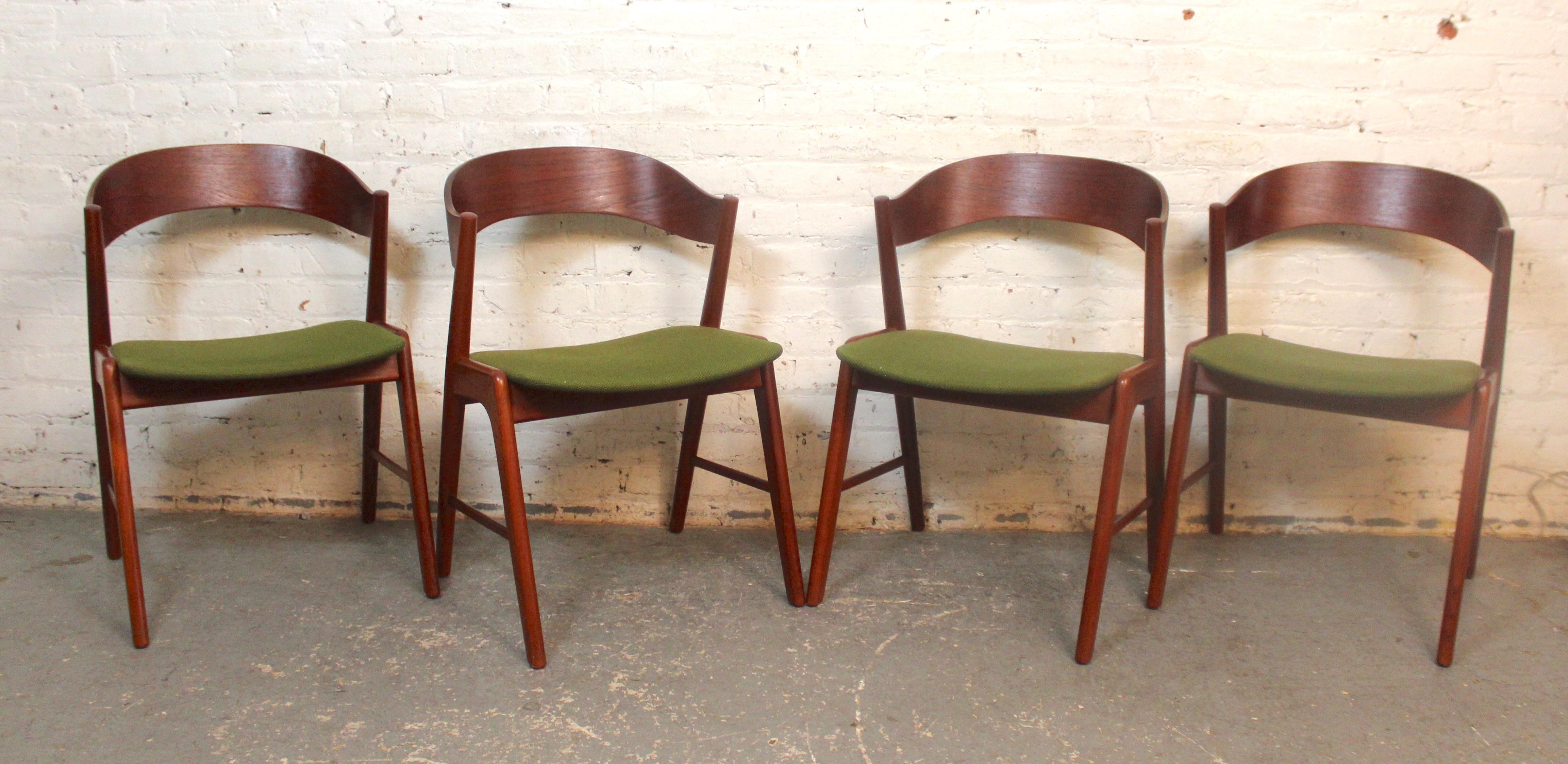 This set of four dining chairs are a beautiful example of mid-century modern design adapting to comfort. The standout feature is the bentwood backs that arch out for support. The frame is made of teak wood, and is sculpted in a zig-zag