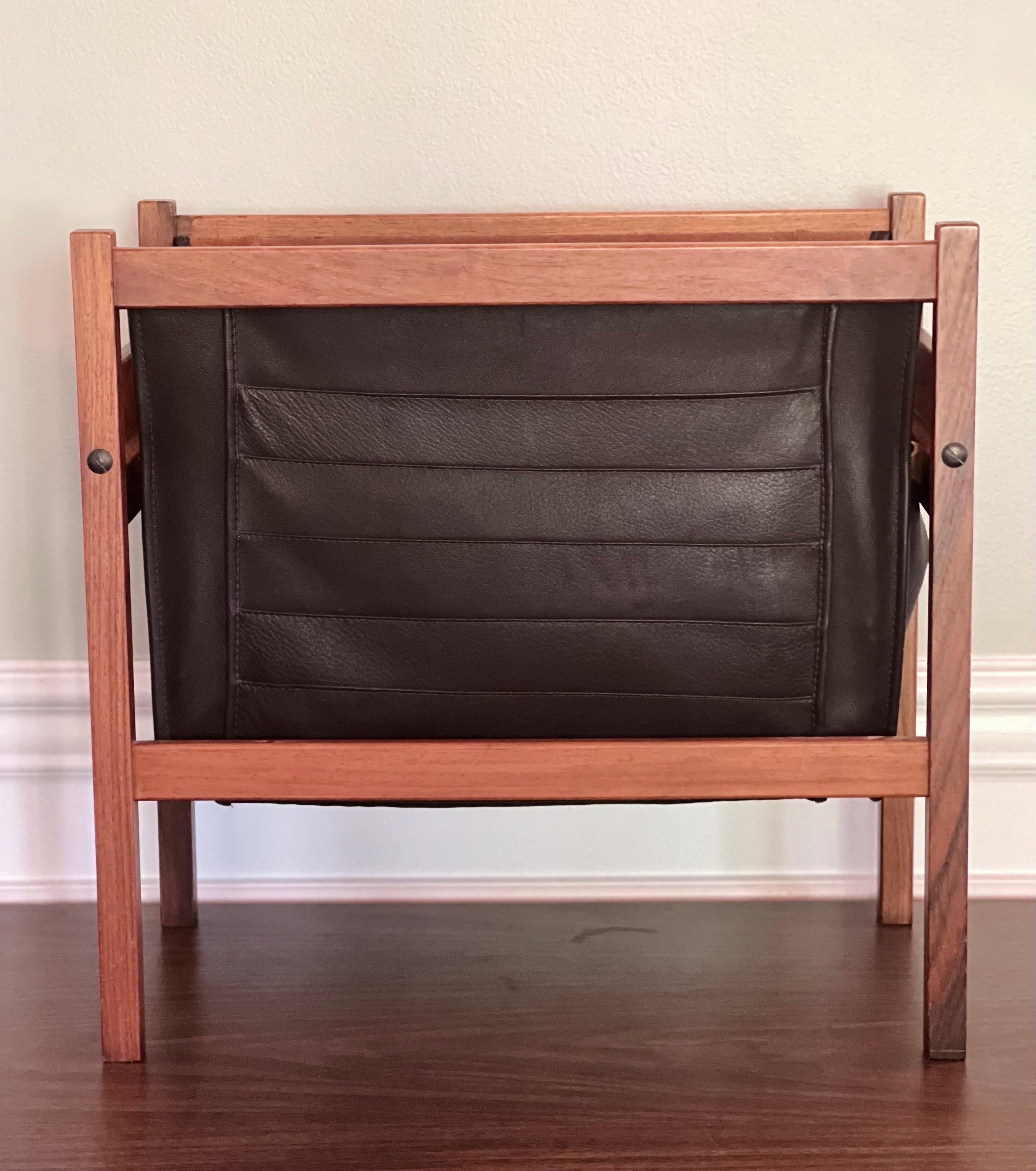 Mid-century Danish rosewood and leather magazine rack, 1960's. 

Handsome magazine holder which features a sturdy rosewood frame with smooth and supple deep brown leather with channel quilting. Inside is natural suede with a removable, divided