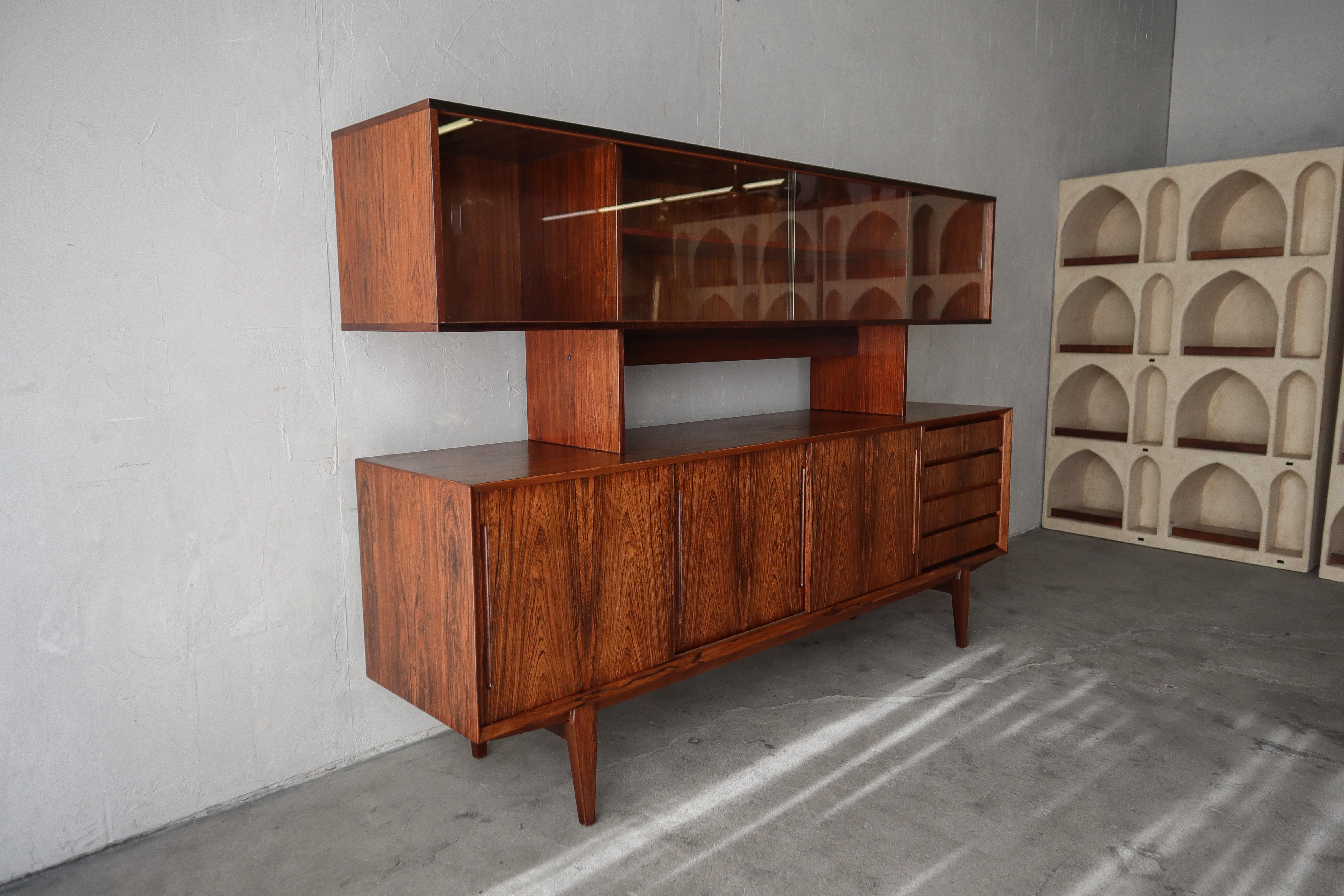 This is beautiful mid century Danish rosewood credenza with hutch by Poul Hundevad.  This credenza is so simple but absolutely gorgeous. It features the most beautifully grained rosewood.  Danish pieces are highly coveted for their simplicity and