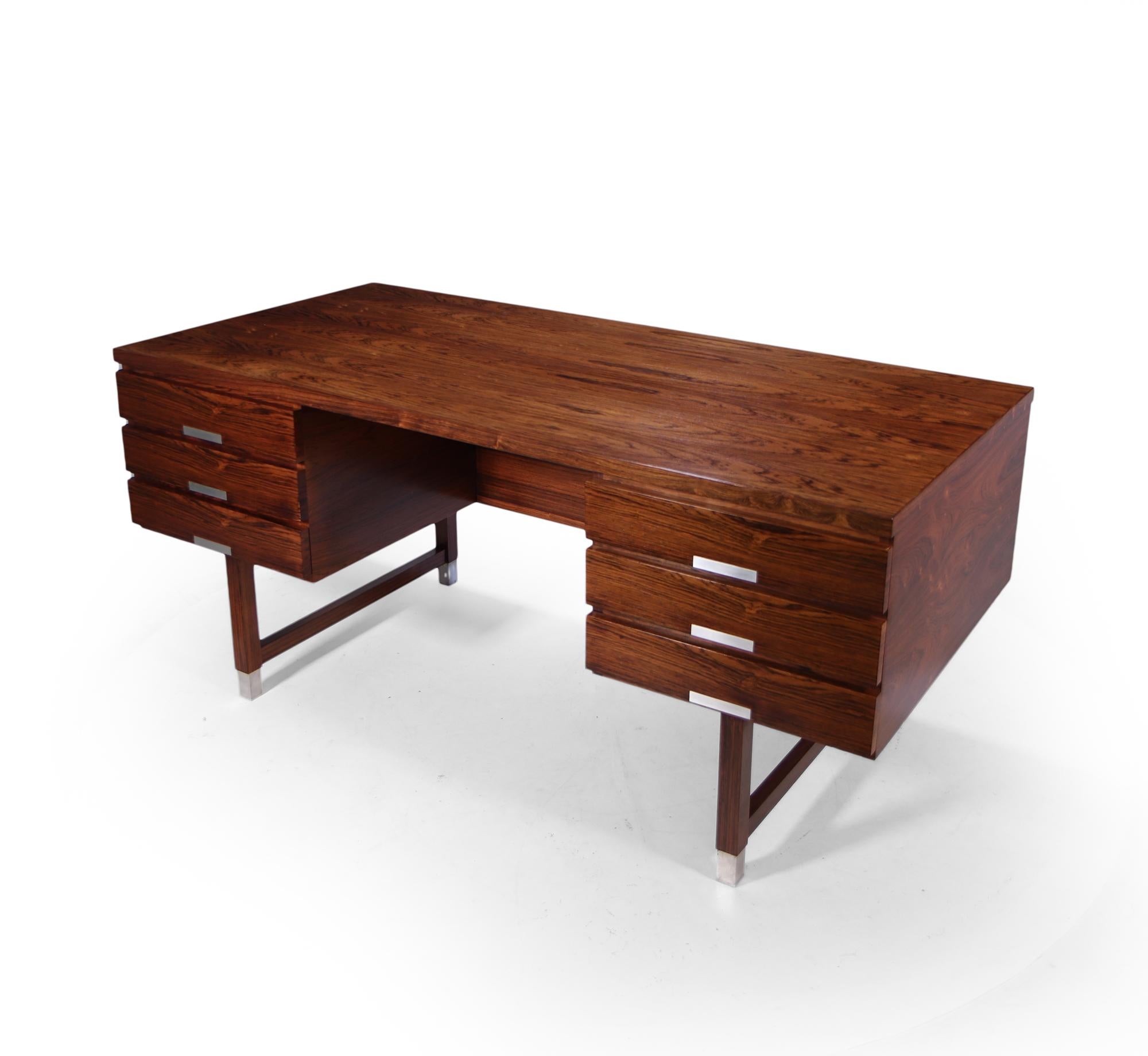 A very stylish desirable mid century rosewood desk designed and produced by Ejgil Petersen in the 1960’s, having six drawers and open bookshelf to the back making it completely freestanding. Aluminium handles and feet tips, in very good condition