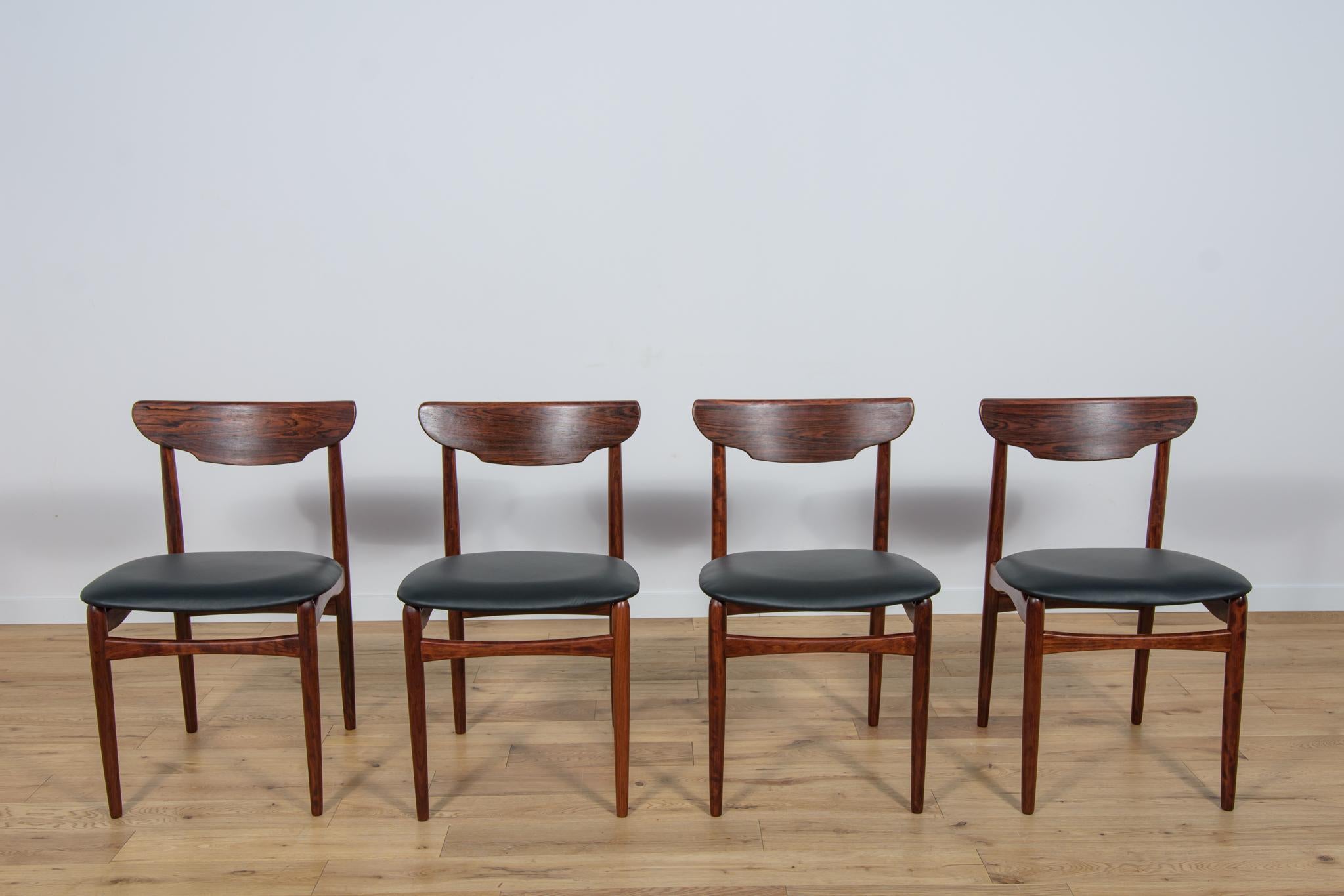 The set of four chairs was produced in Denmark in the 1960s. The chairs have an interesting form combined with high craftsmanship, characteristic of Danish design, as evidenced by, among others, unique backrests. Frame made of rosewood. Upholstery