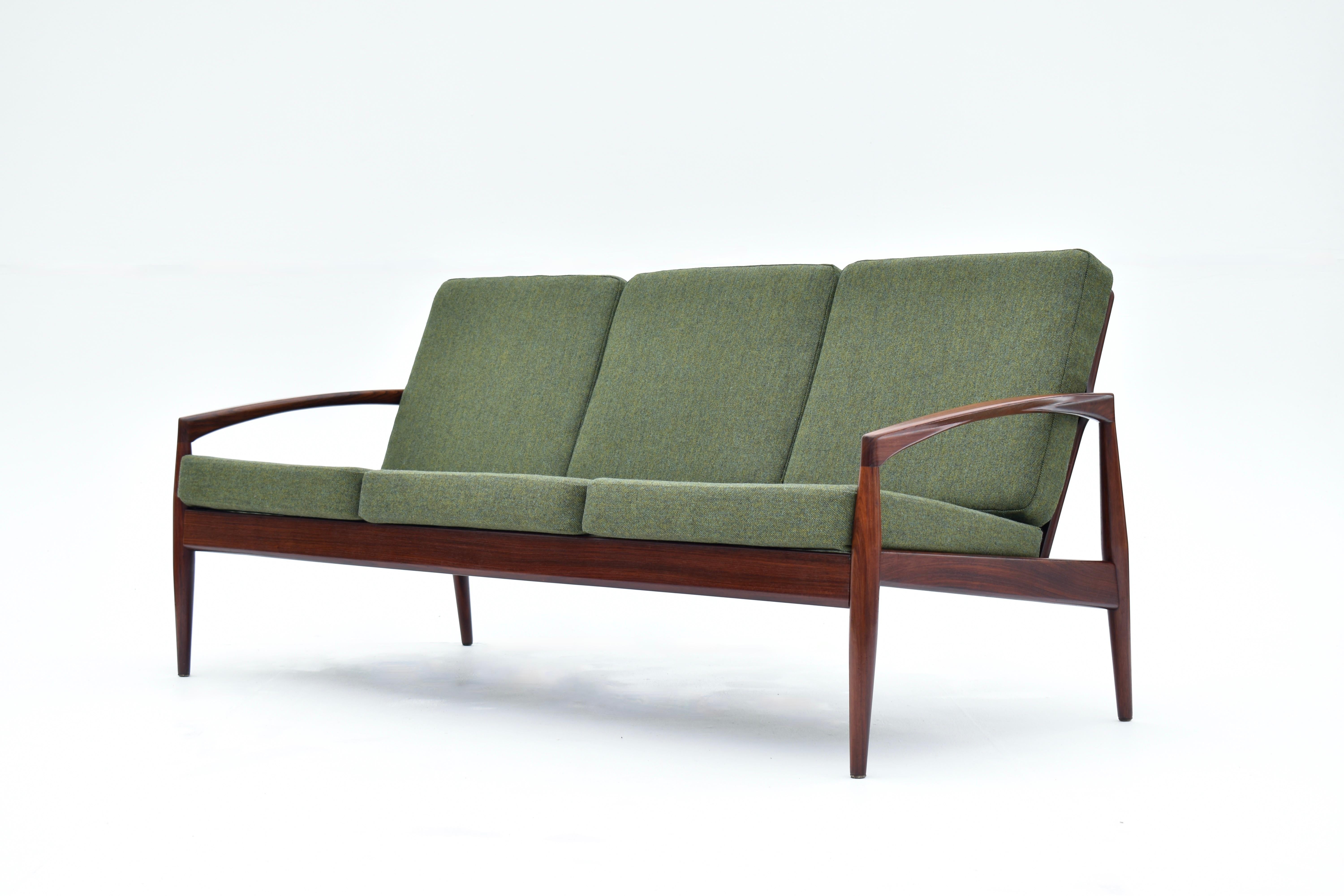 A very rarely seen ‘Paper Knife’ sofa designed by Kai Kristainsen for Magnus Olesen.

Crafted from solid rosewood the frame is a sculptural masterpiece exhibiting incredible finesse and as such is recognised as one of Kai Kristiansens greatest