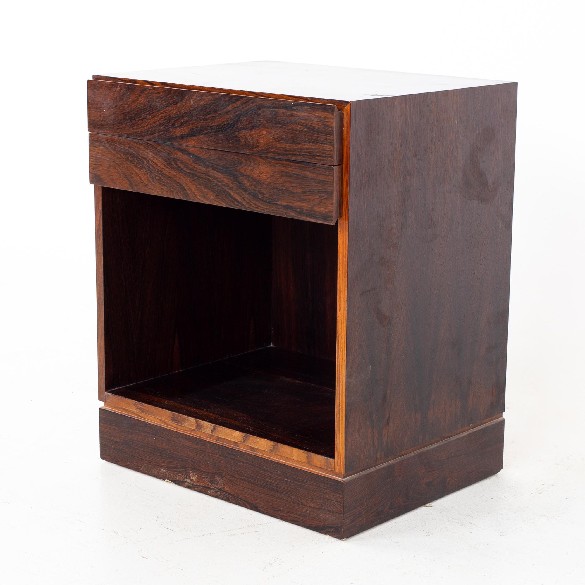 Mid Century Danish rosewood nightstand
Nightstand measures: 18.5 wide x 15 deep x 22.5 inches high

All pieces of furniture can be had in what we call restored vintage condition. That means the piece is restored upon purchase so it’s free of