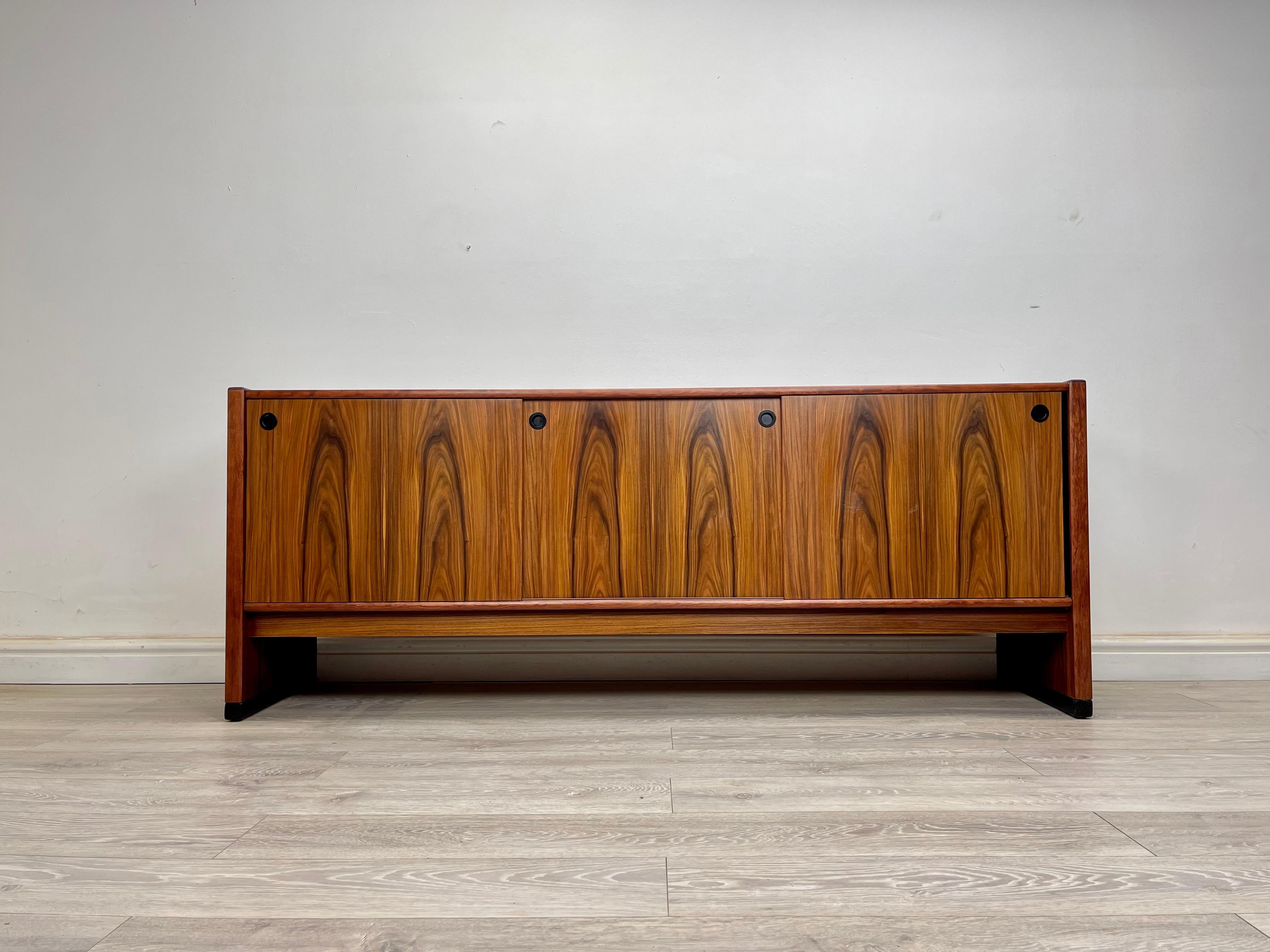 SIDEBOARD 
Stunning midcentury Danish rosewood sideboard made by Skovby circa 1970s showroom condition . 

The sideboard has sleek Minimalist design with plenty of storage , stunning rosewood grain throughout . 

There’s three sliding doors